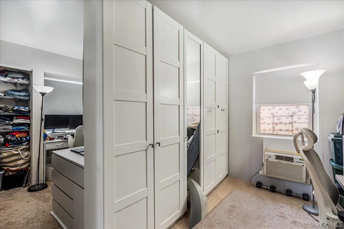Closet featuring a wall mounted air conditioner Closet featuring a wall mounted air conditioner