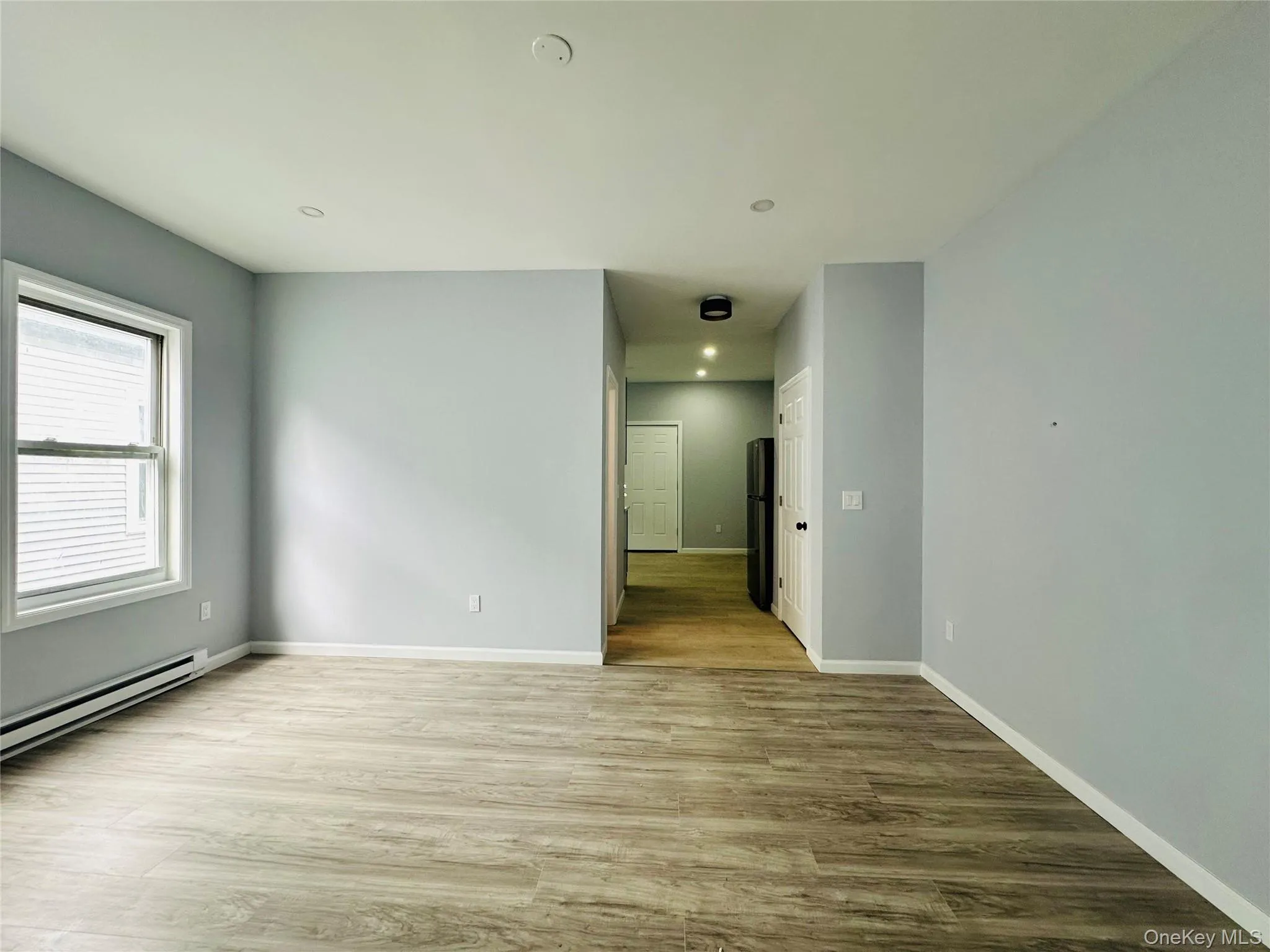 Unfurnished room featuring light wood-style floors and recessed lighting Unfurnished room featuring light wood-style floors and recessed lighting