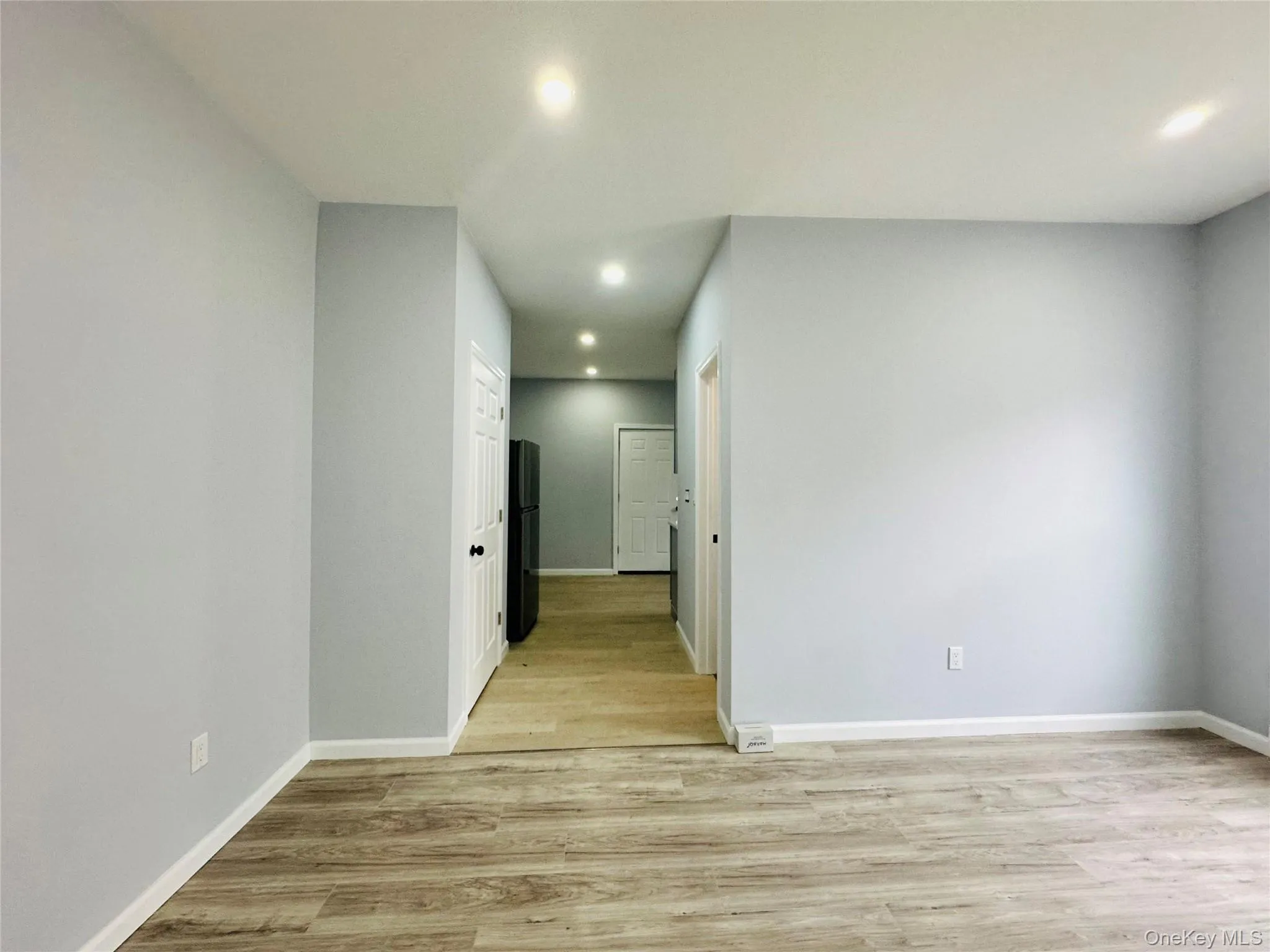 Unfurnished room with recessed lighting and light wood finished floors Unfurnished room with recessed lighting and light wood finished floors