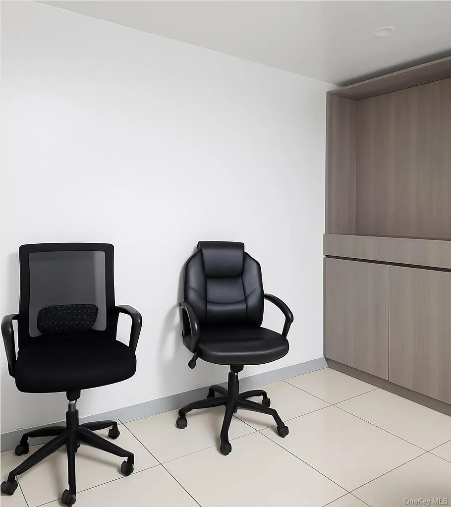 Office area featuring light tile patterned floors Office area featuring light tile patterned floors