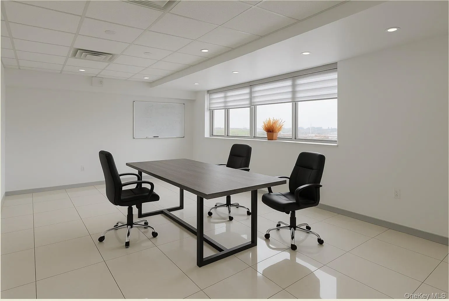 Office area with a drop ceiling, light tile patterned floors, and recessed lighting Office area with a drop ceiling, light tile patterned floors, and recessed lighting
