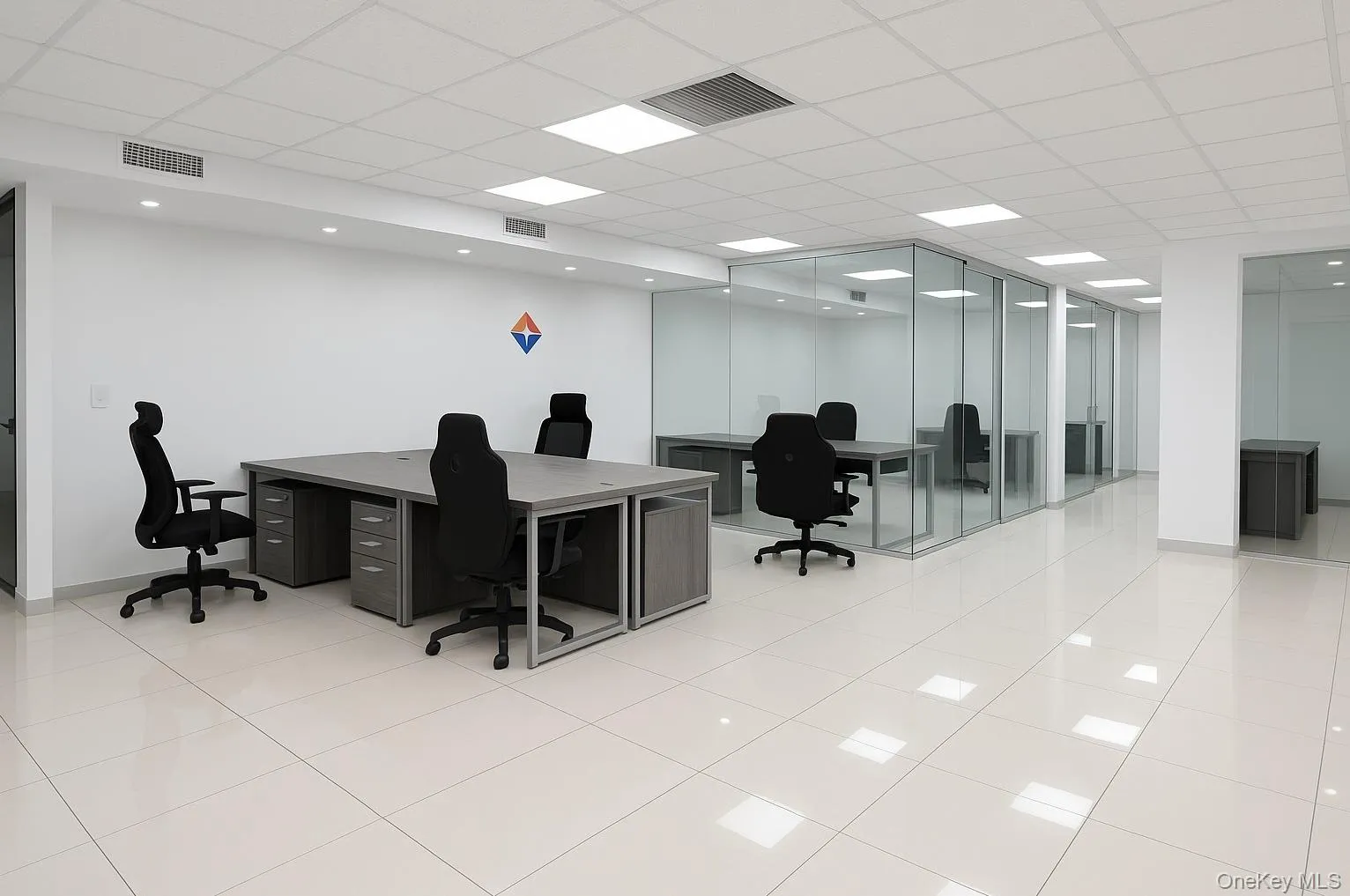 Office space with a paneled ceiling and light tile patterned floors Office space with a paneled ceiling and light tile patterned floors