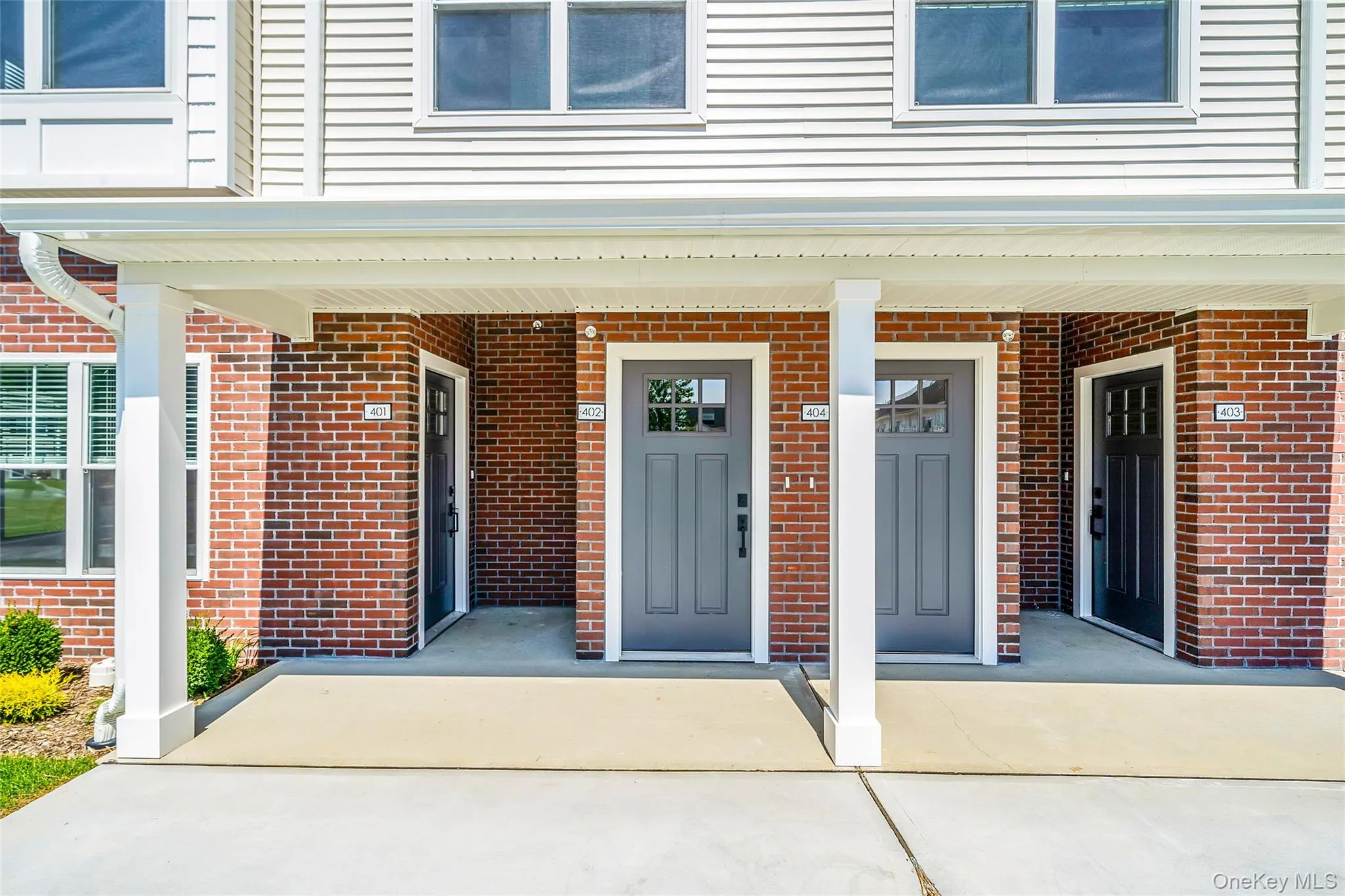 Doorway to property with brick siding and covered porch Doorway to property with brick siding and covered porch