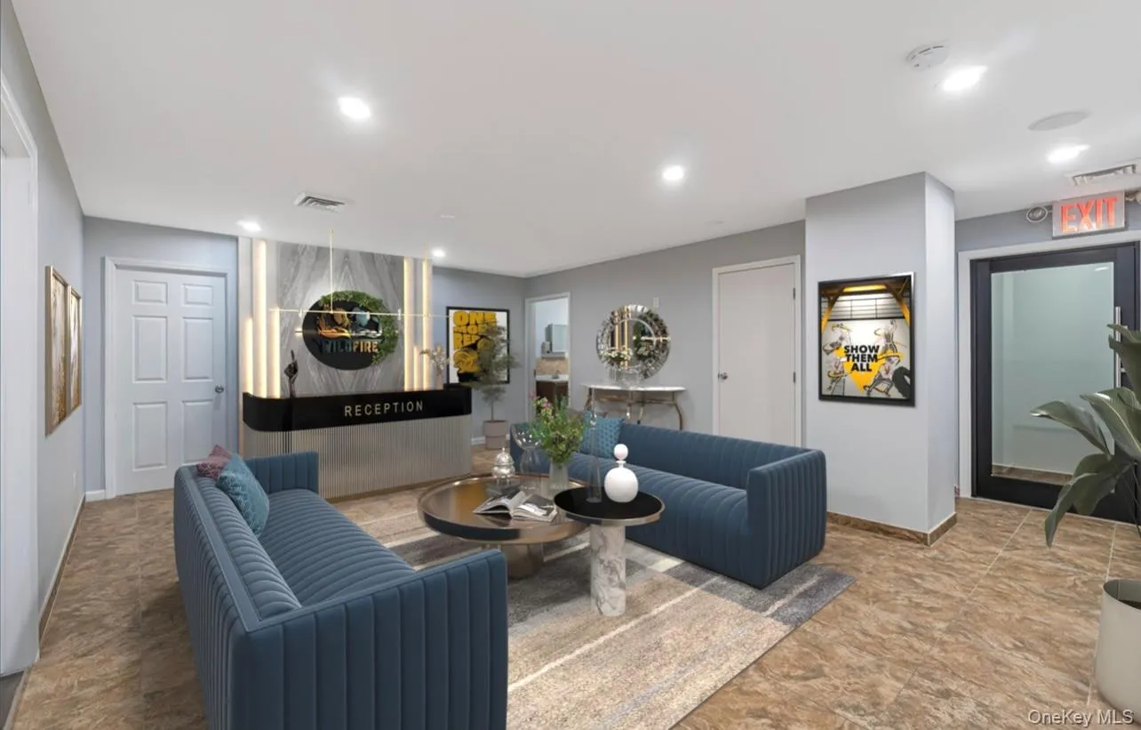 Living room featuring recessed lighting and stone finish flooring Living room featuring recessed lighting and stone finish flooring