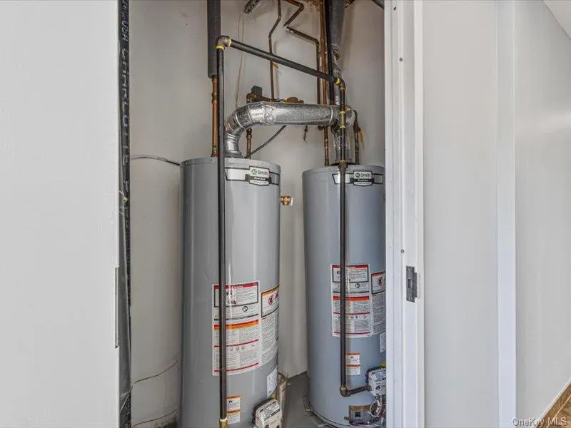 Utility room with water heater Utility room with water heater