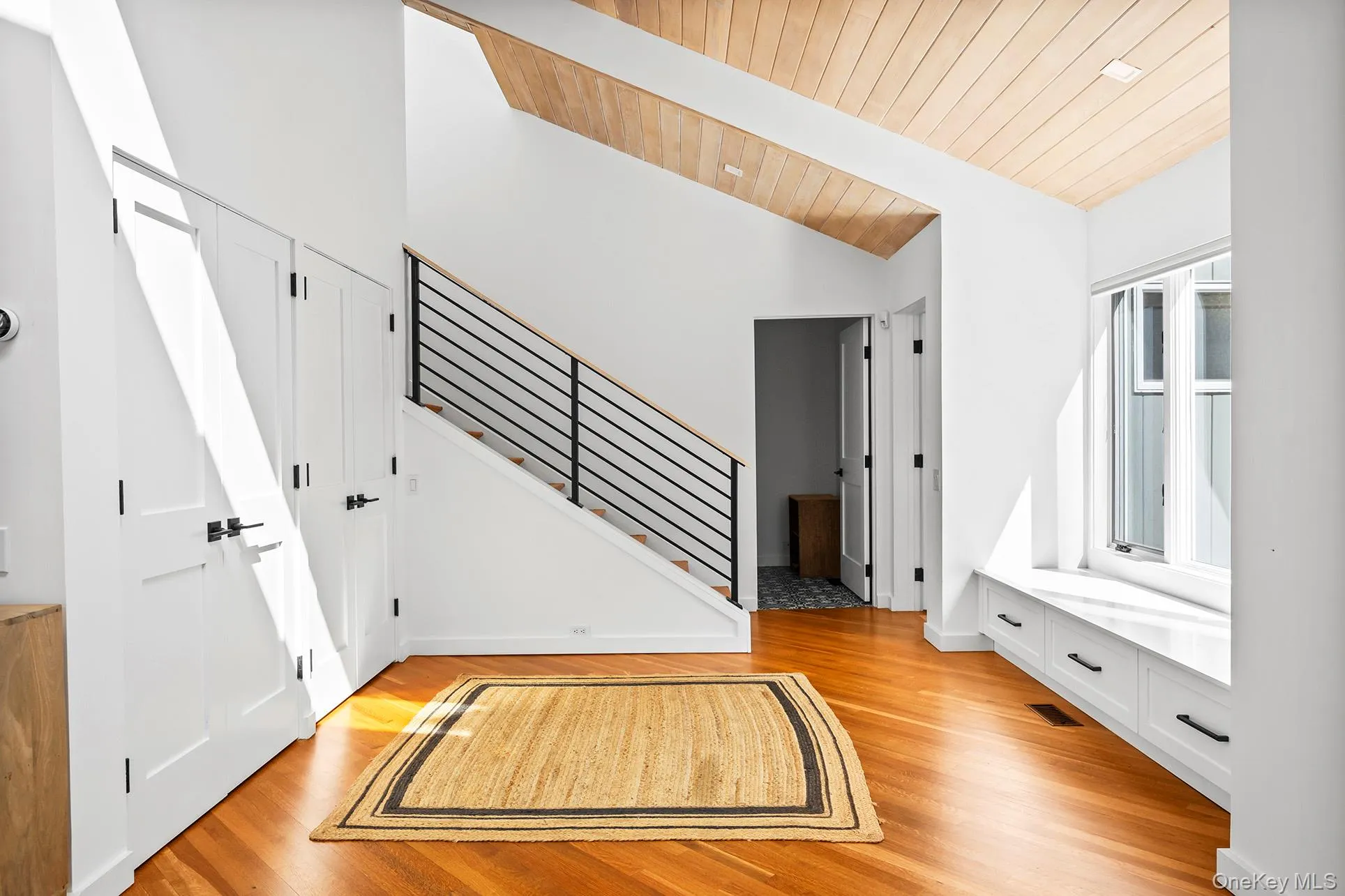 Entrance foyer featuring stairs, light wood-type flooring, and ceiling Entrance foyer featuring stairs, light wood-type flooring, and ceiling