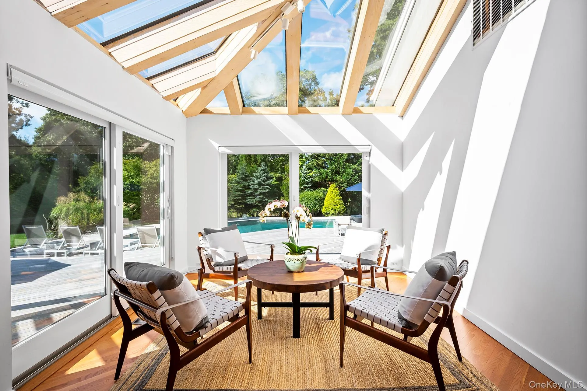 Family room with a skylight, plenty of natural light, and lofted ceiling Family room with a skylight, plenty of natural light, and lofted ceiling