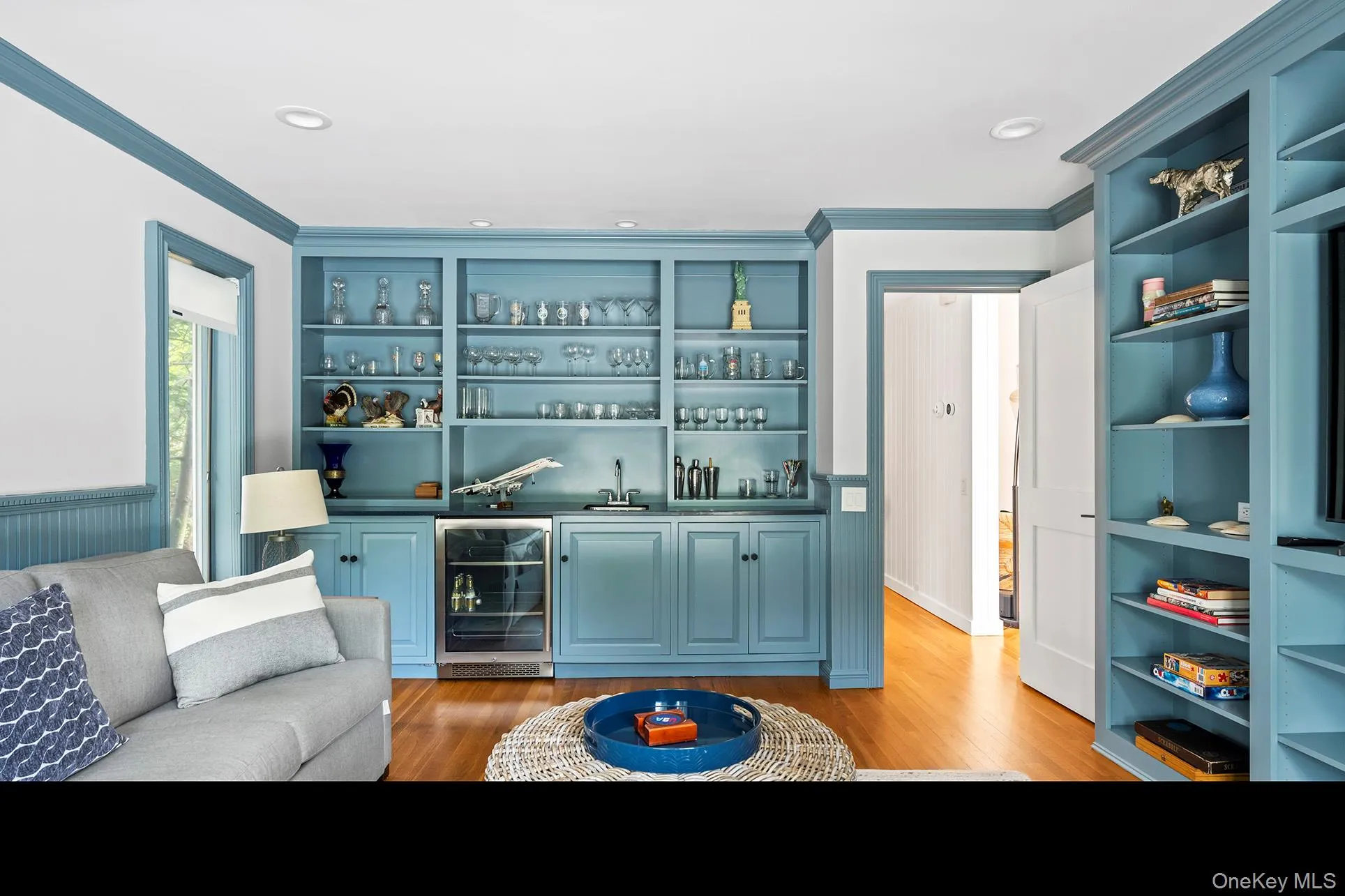 Den and wet bar featuring open shelves Den and wet bar featuring open shelves