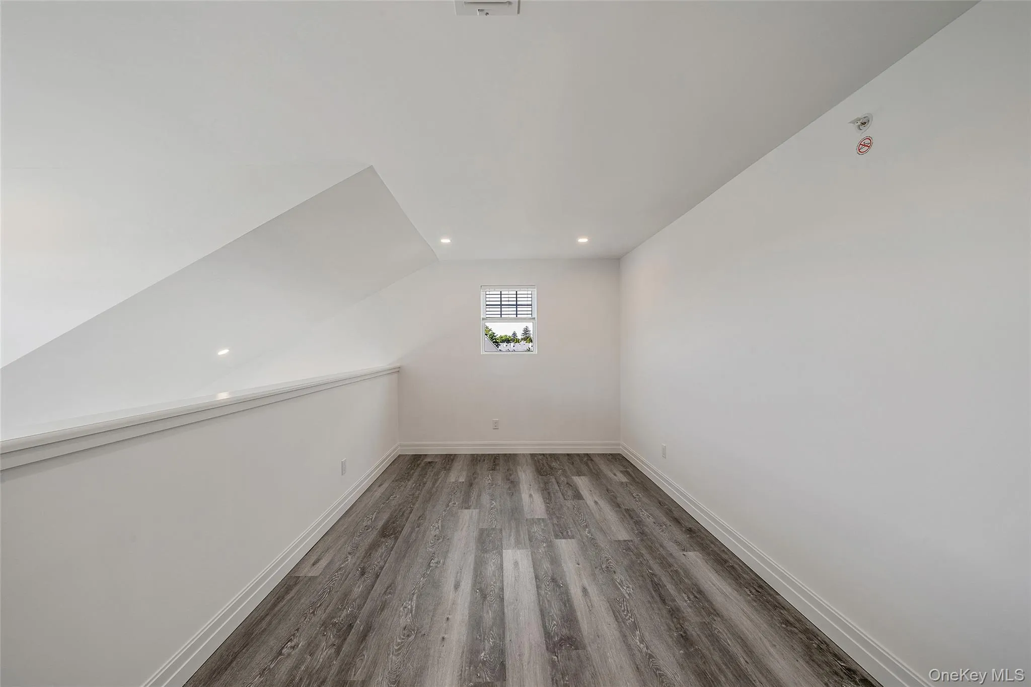 Bonus room featuring light wood finished floors, recessed lighting, and lofted ceiling Bonus room featuring light wood finished floors, recessed lighting, and lofted ceiling