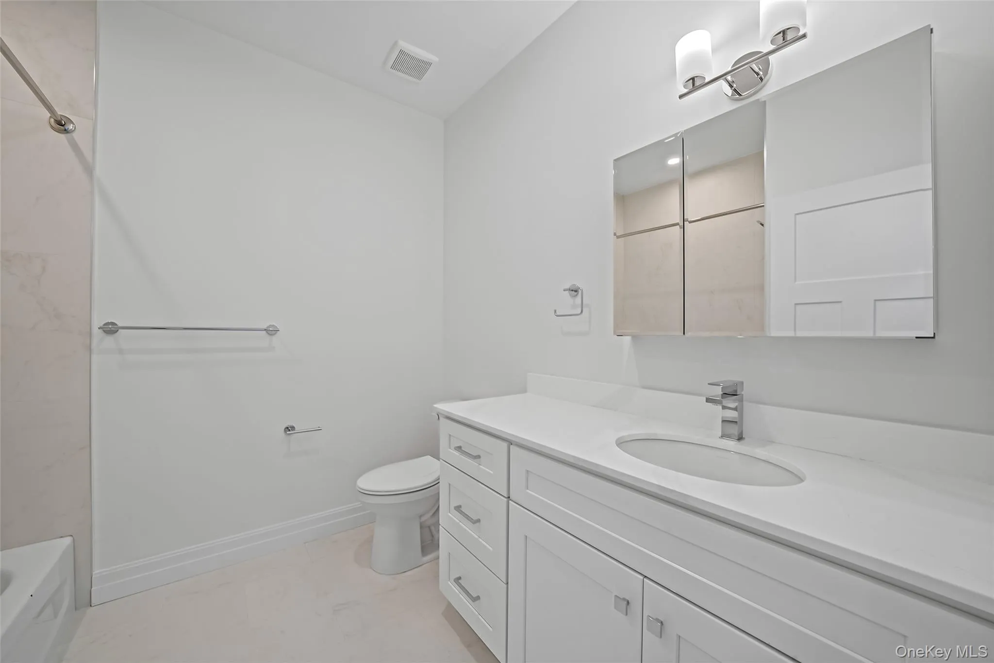 Bathroom with vanity and shower / tub combination Bathroom with vanity and shower / tub combination