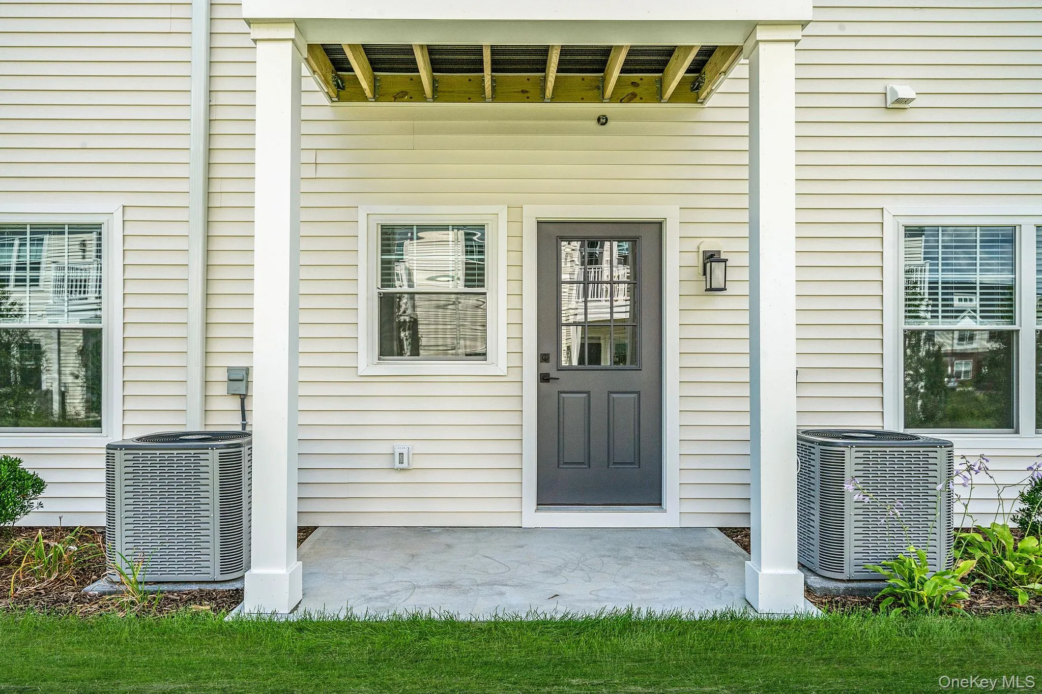Doorway to property featuring a patio area Doorway to property featuring a patio area