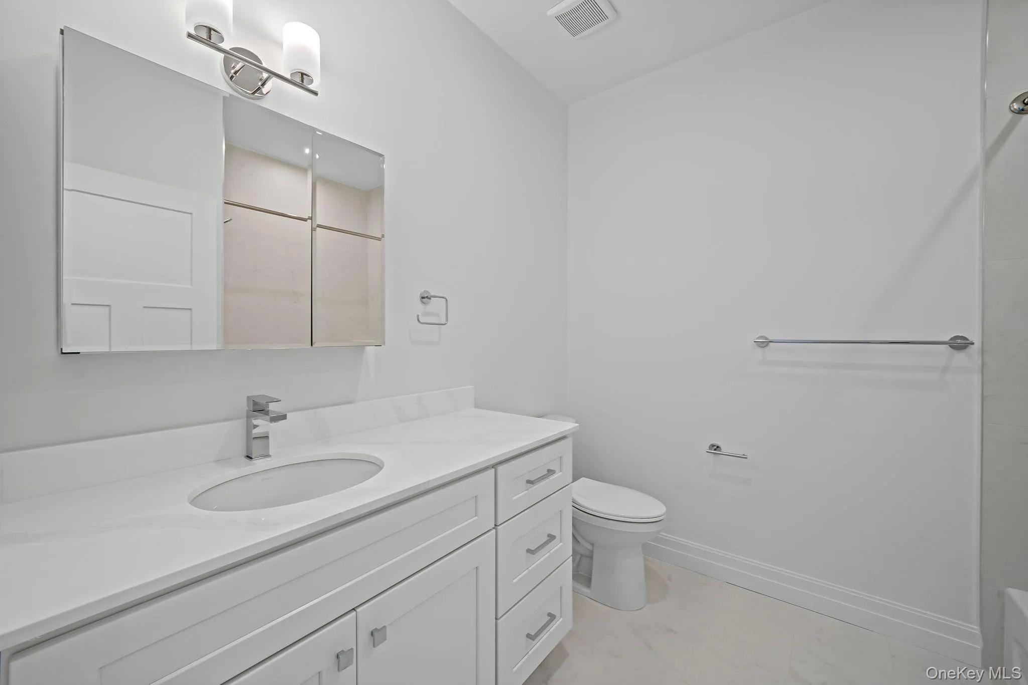 Full bath with vanity and a shower Full bath with vanity and a shower