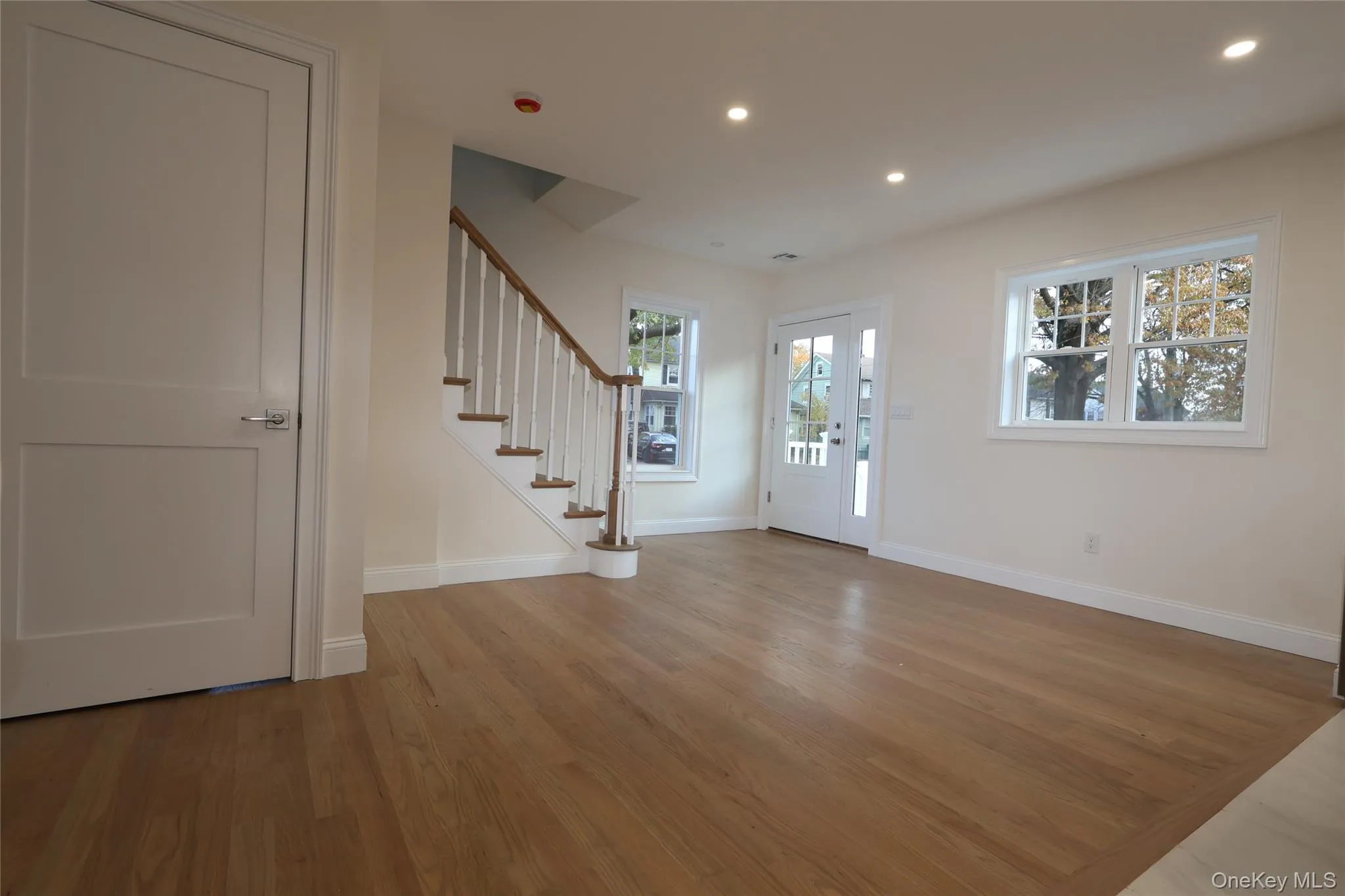 Mud Room/Rear Entry Foyer featuring stairs, light wood-style floors, and recessed lighting Mud Room/Rear Entry Foyer featuring stairs, light wood-style floors, and recessed lighting