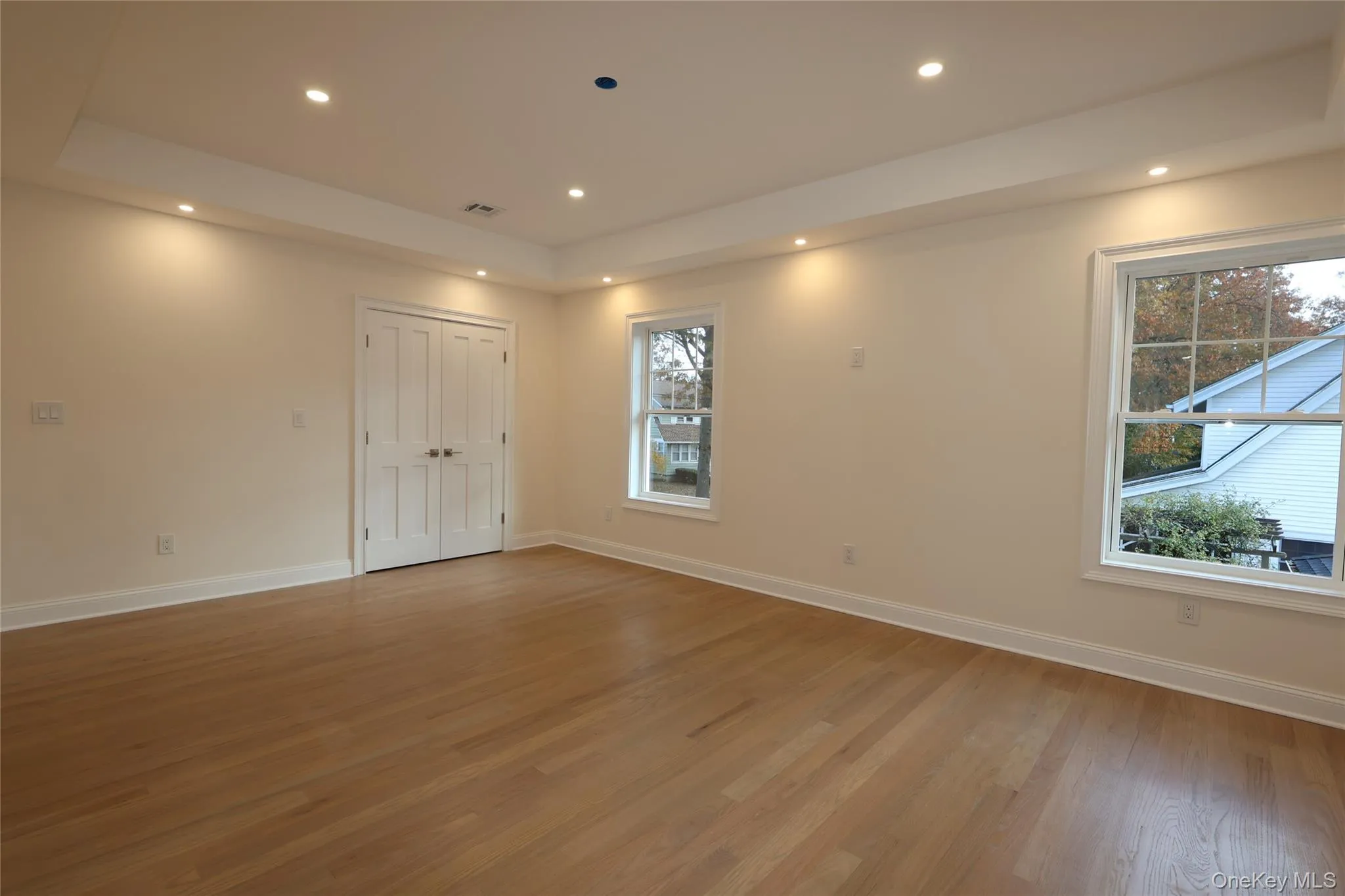 Primary Bedroom with a tray ceiling and 2 closets Primary Bedroom with a tray ceiling and 2 closets