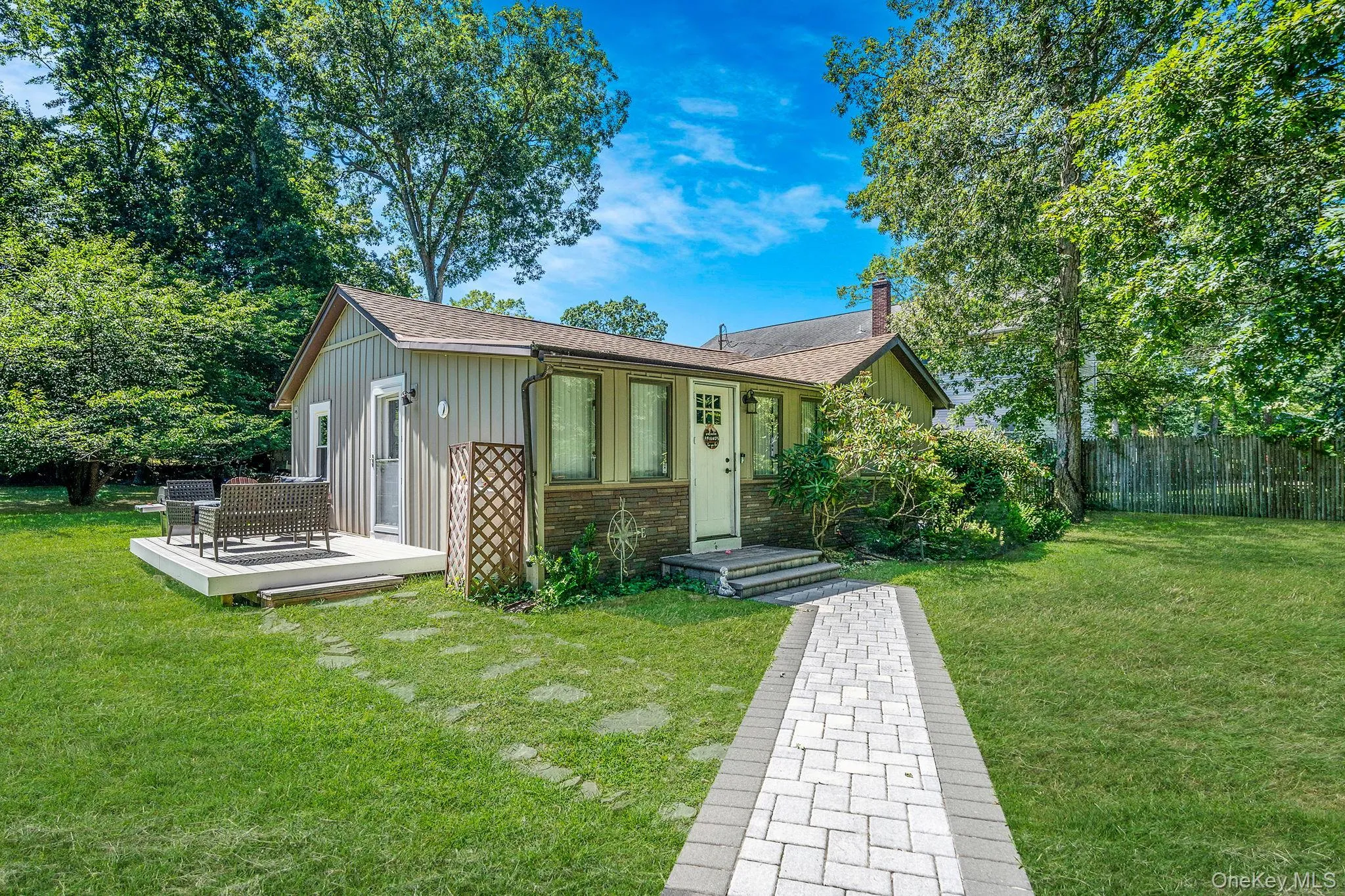 View of front of home featuring board and batten siding, a chimney, and roof with shingles View of front of home featuring board and batten siding, a chimney, and roof with shingles