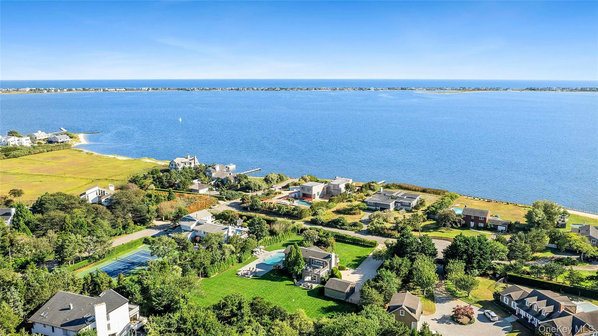 Aerial view of residential area with a large body of water Aerial view of residential area with a large body of water