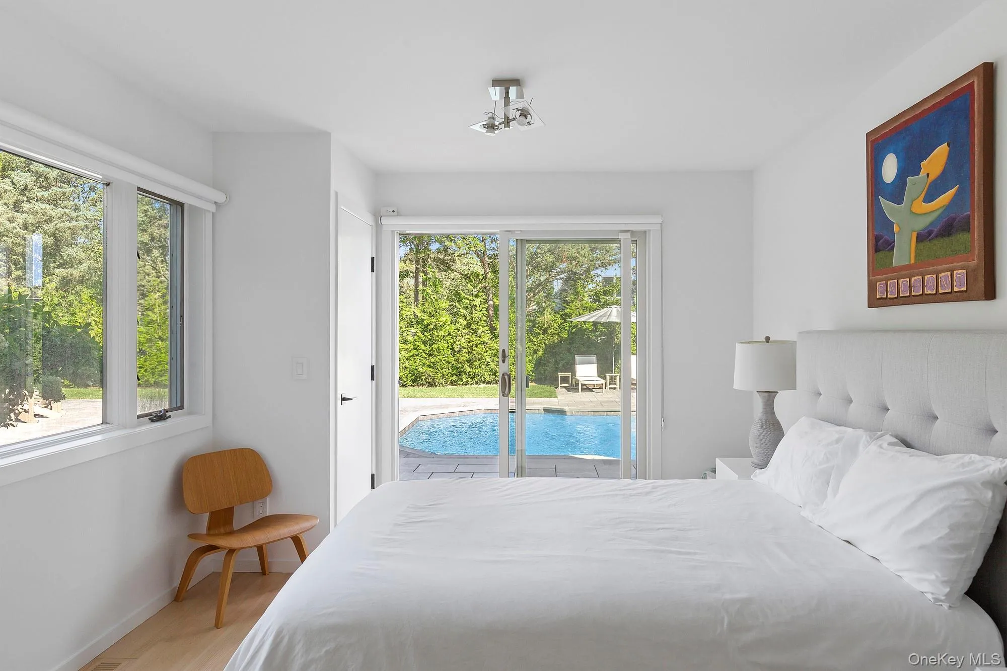 Bedroom with access to exterior and multiple windows Bedroom with access to exterior and multiple windows
