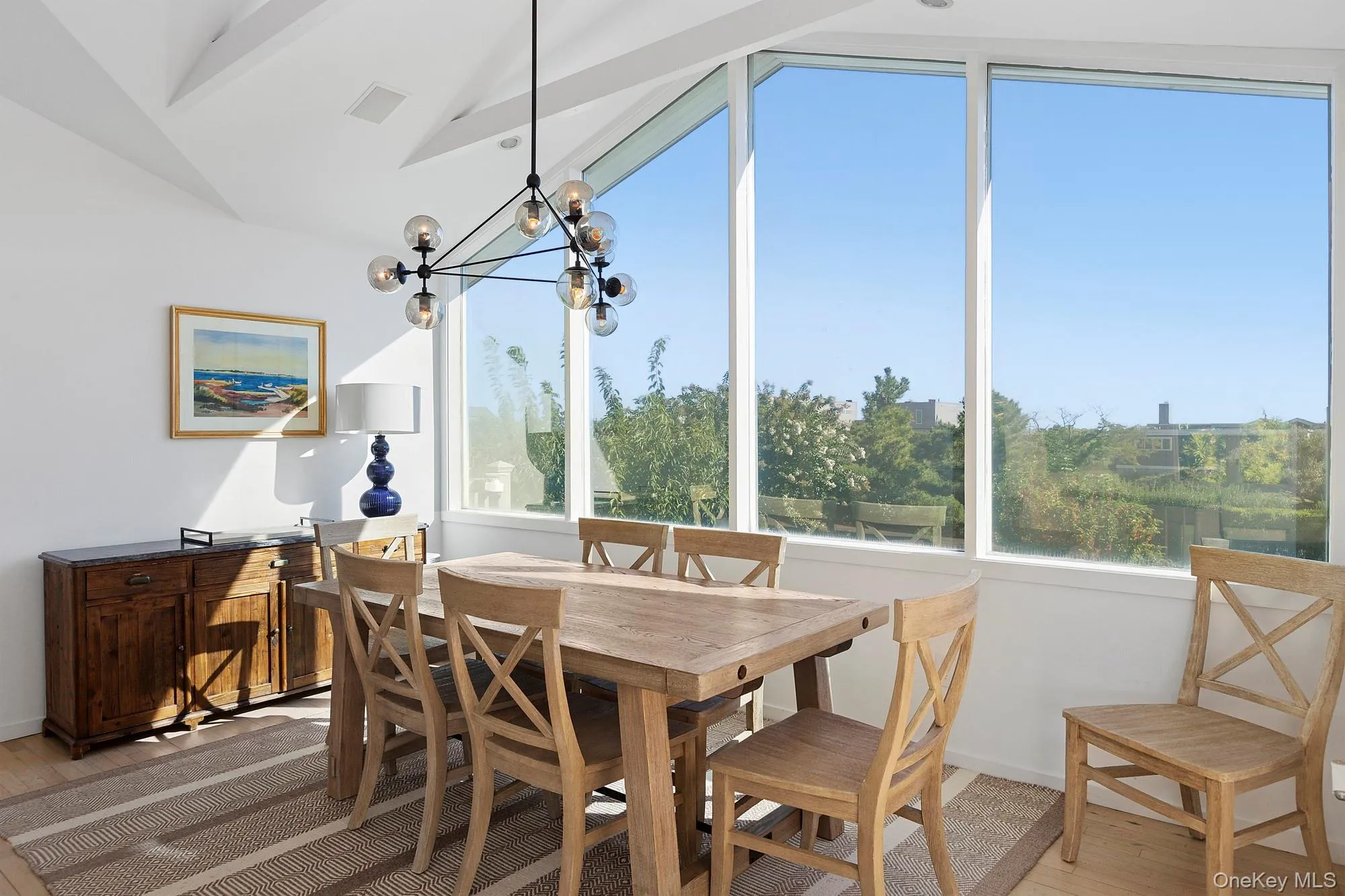 Sunroom featuring a chandelier Sunroom featuring a chandelier
