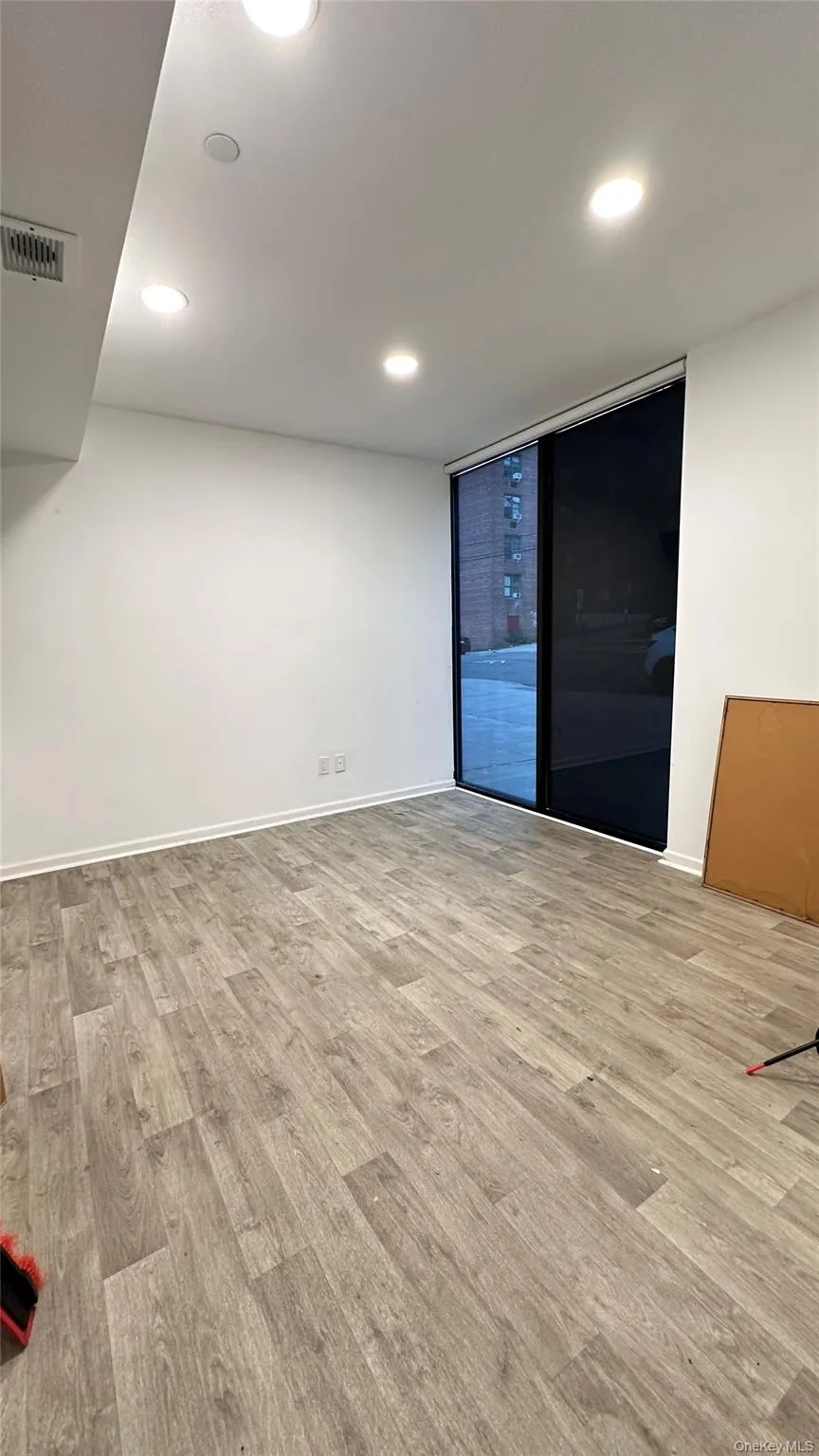 Spare room featuring recessed lighting and light wood finished floors Spare room featuring recessed lighting and light wood finished floors