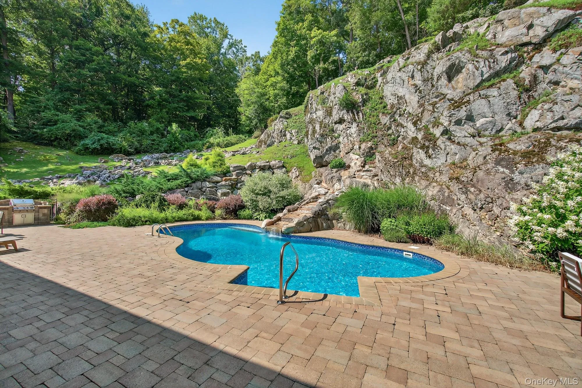 Outdoor pool featuring a patio area - with pool and dining area Outdoor pool featuring a patio area - with pool and dining area