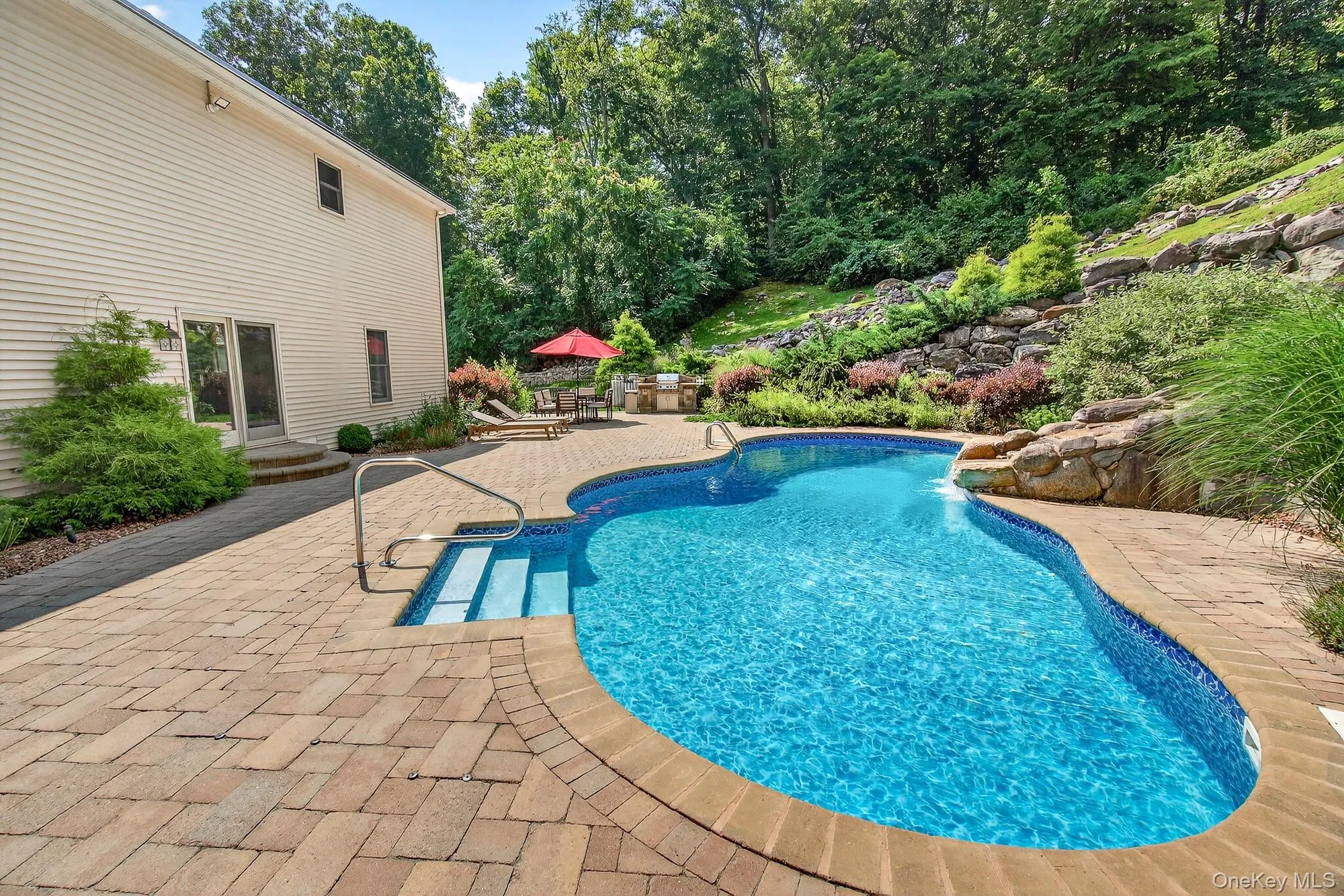 Outdoor pool with a patio Outdoor pool with a patio