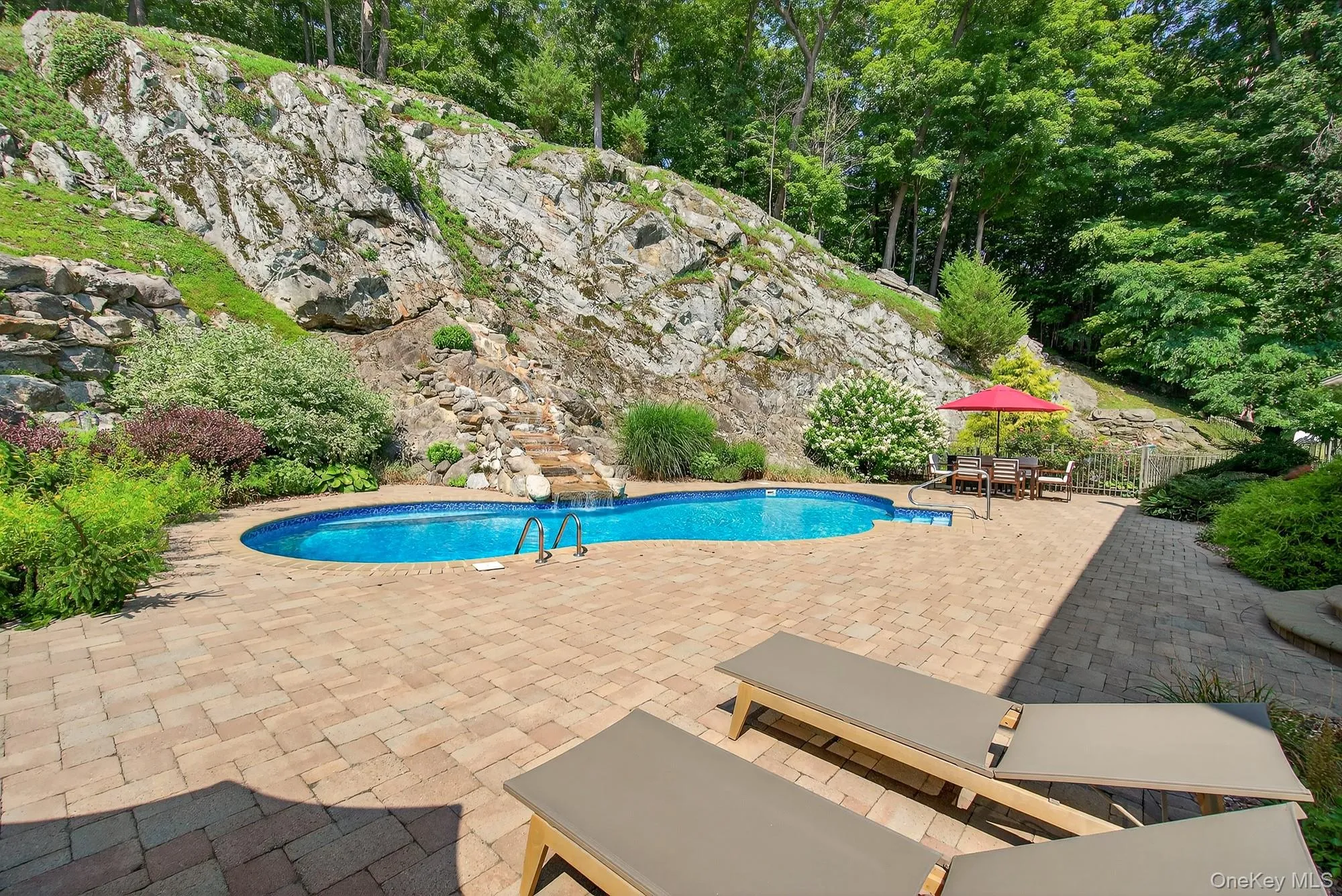 Swimming pool with a patio area Swimming pool with a patio area