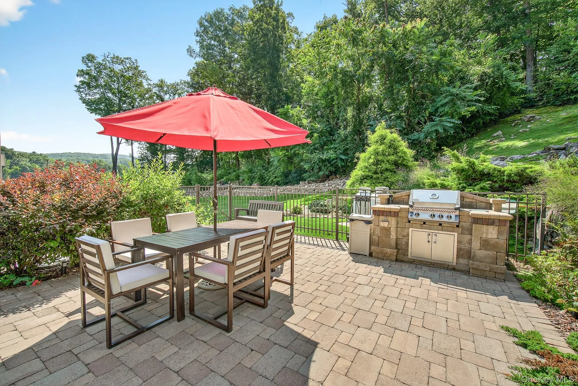 View of patio featuring area for grilling and outdoor dining area View of patio featuring area for grilling and outdoor dining area
