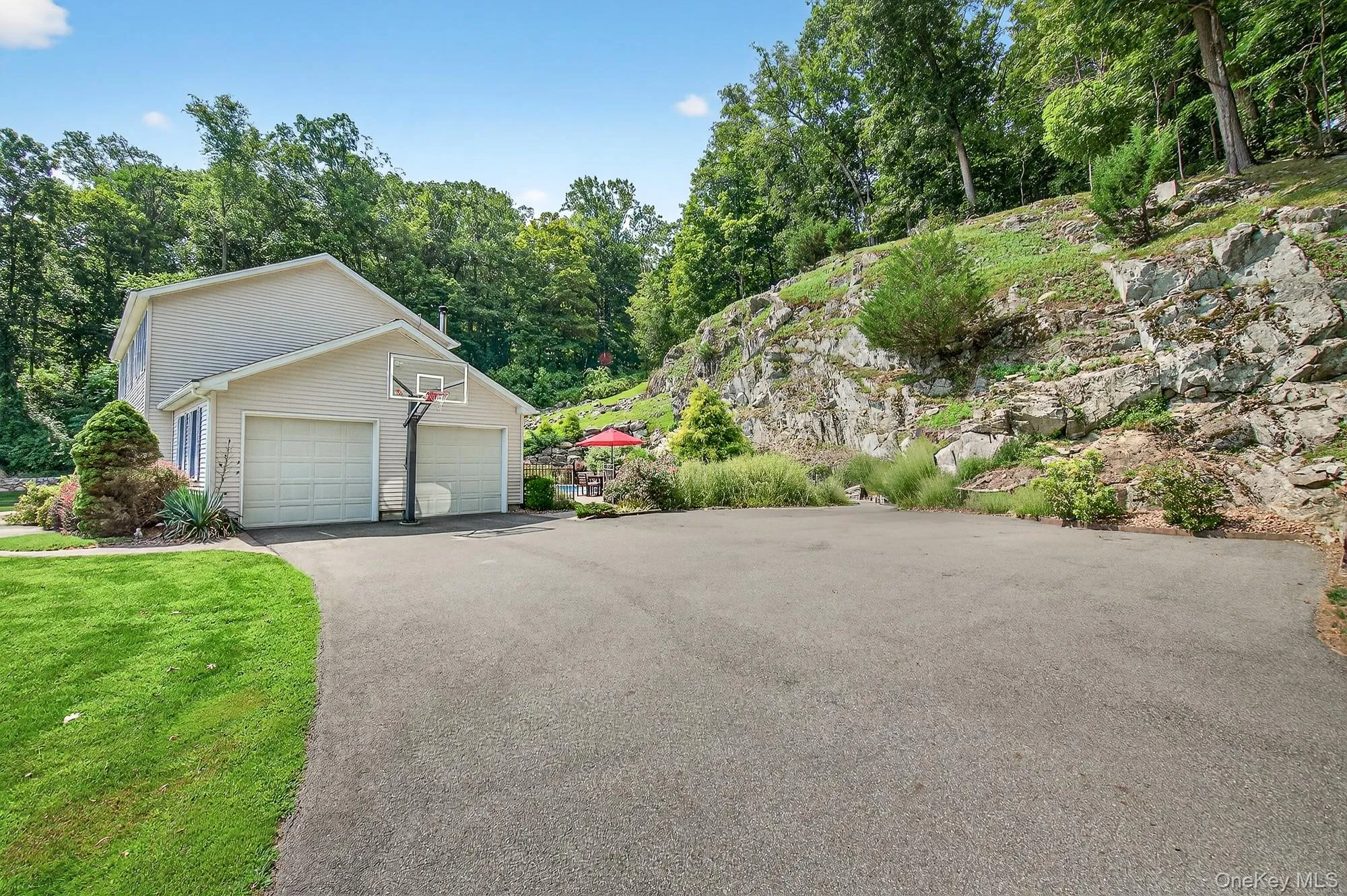 View of side of property featuring a garage View of side of property featuring a garage