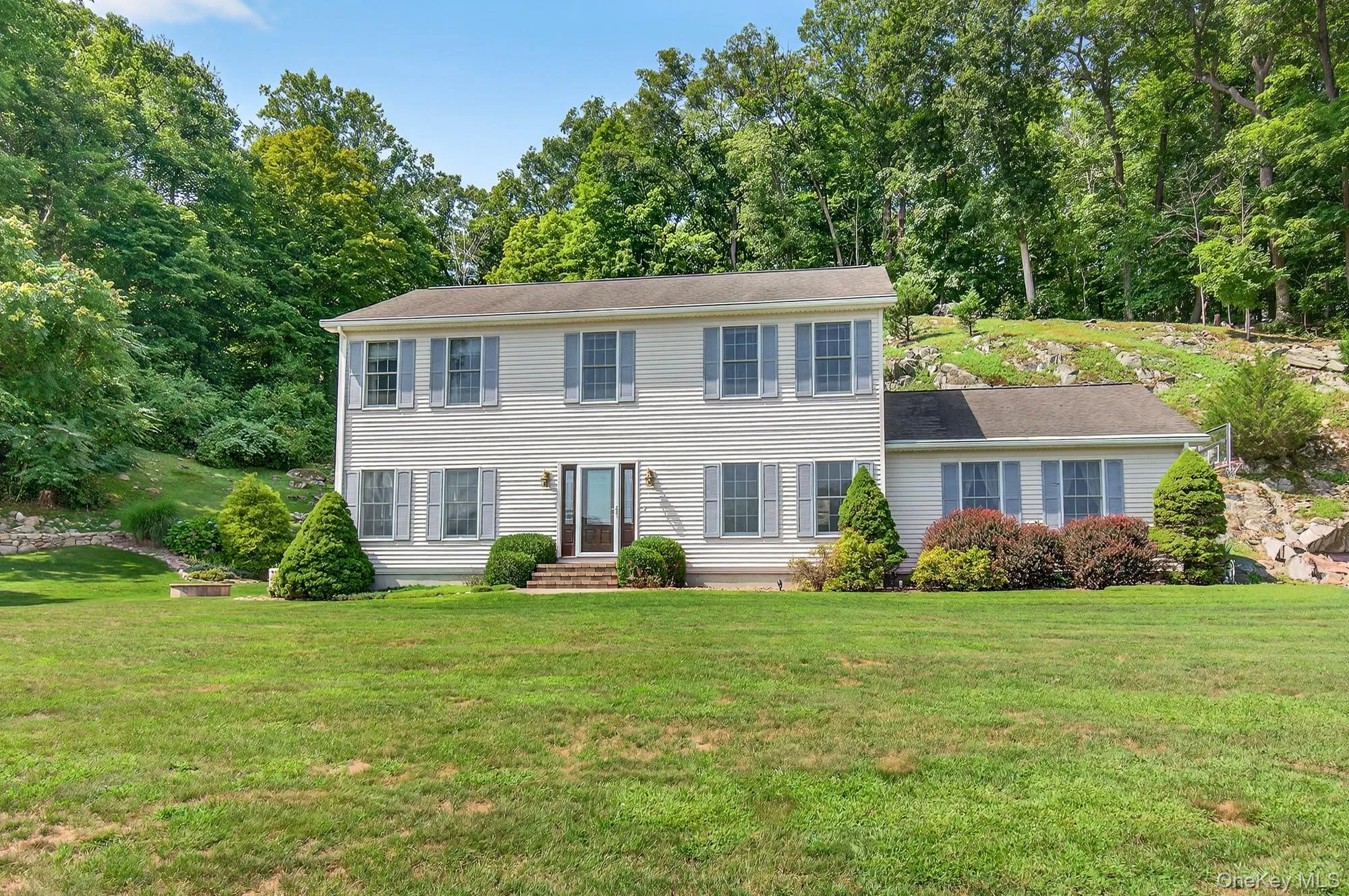 Colonial-style house nestled into the hill Colonial-style house nestled into the hill