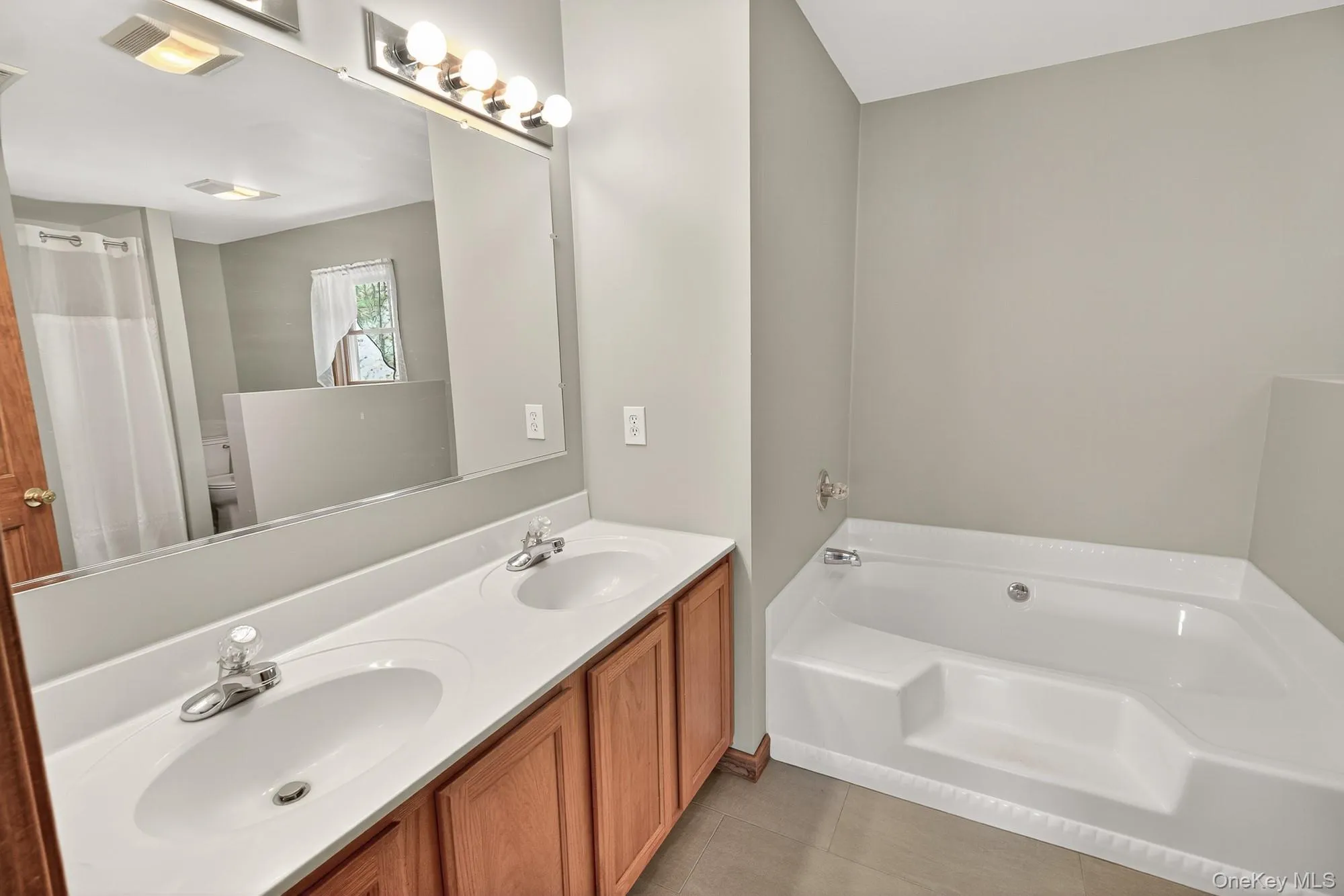 Primary Full bathroom with a double vanity Primary Full bathroom with a double vanity