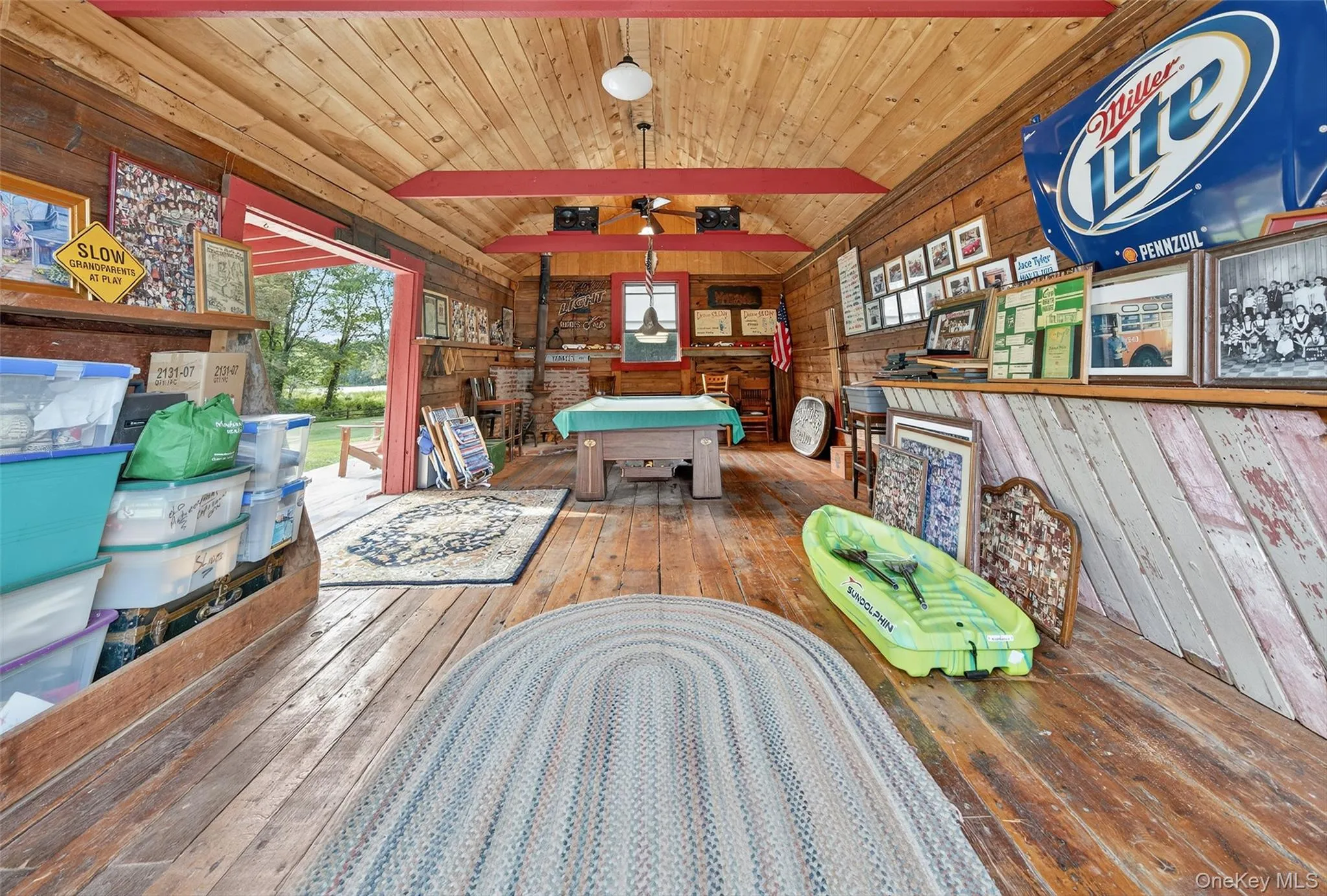 Game room with wood walls, hardwood / wood-style flooring, wood ceiling, and billiards Game room with wood walls, hardwood / wood-style flooring, wood ceiling, and billiards