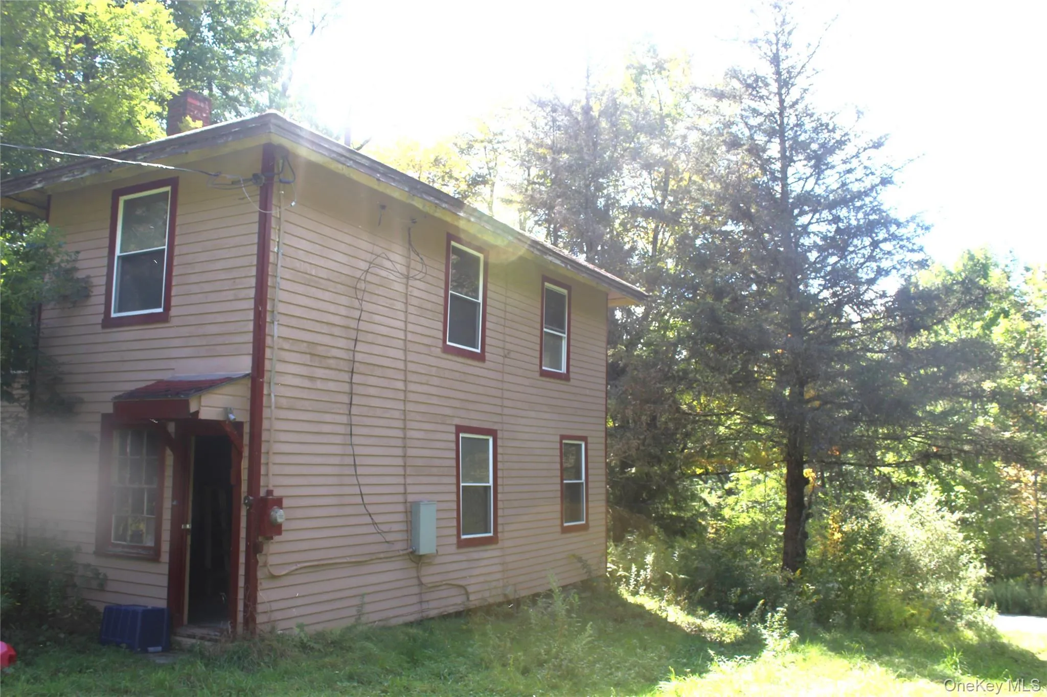 View of home's exterior with a chimney and a central air condition unit View of home's exterior with a chimney and a central air condition unit