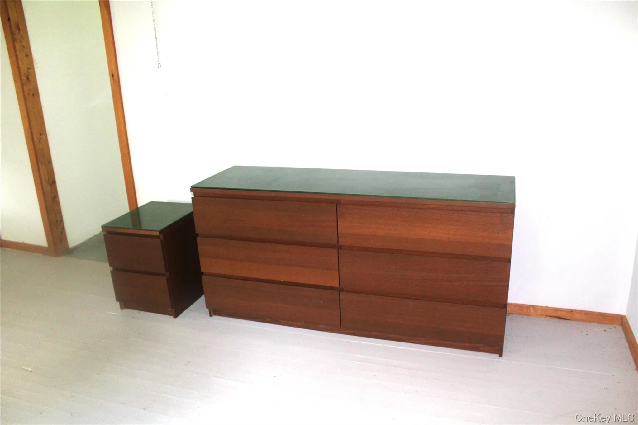 Unfurnished bedroom featuring baseboards and light wood-type flooring Unfurnished bedroom featuring baseboards and light wood-type flooring