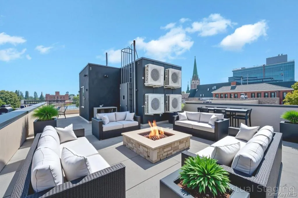 View of patio featuring an outdoor living space with a fire pit View of patio featuring an outdoor living space with a fire pit