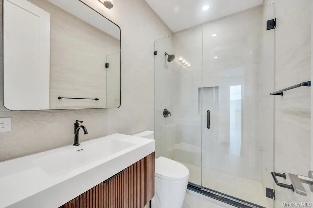 Bathroom with a stall shower and vanity Bathroom with a stall shower and vanity