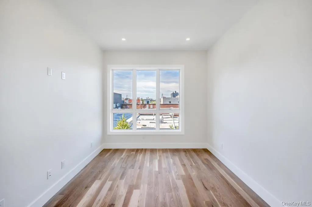 Unfurnished dining area with light wood finished floors and recessed lighting Unfurnished dining area with light wood finished floors and recessed lighting