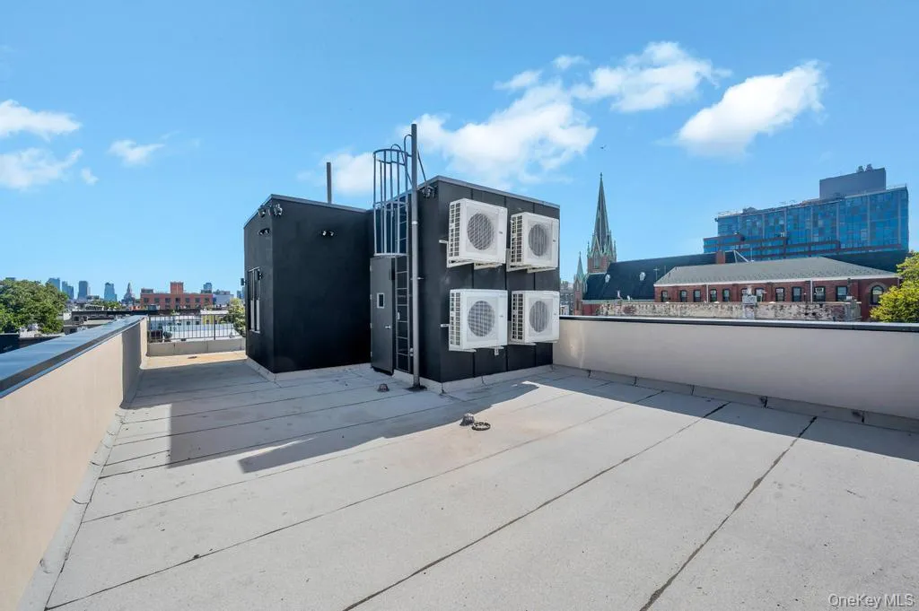 View of property's community with a city view and a patio View of property's community with a city view and a patio