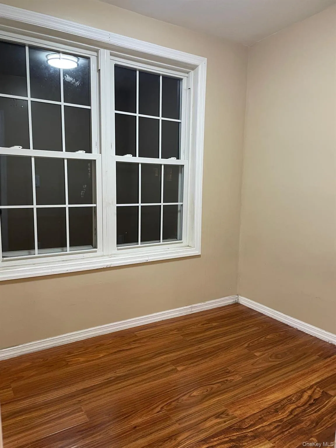 Empty room featuring wood finished floors Empty room featuring wood finished floors