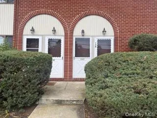 View of exterior entry featuring brick siding View of exterior entry featuring brick siding