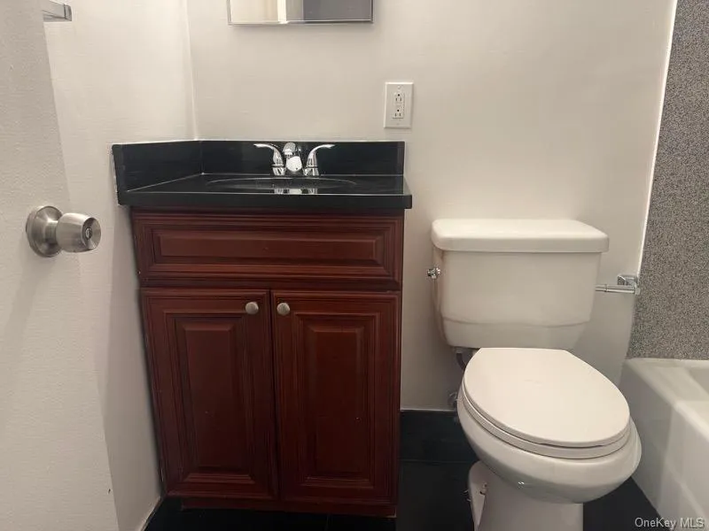 Bathroom with vanity and a tub Bathroom with vanity and a tub