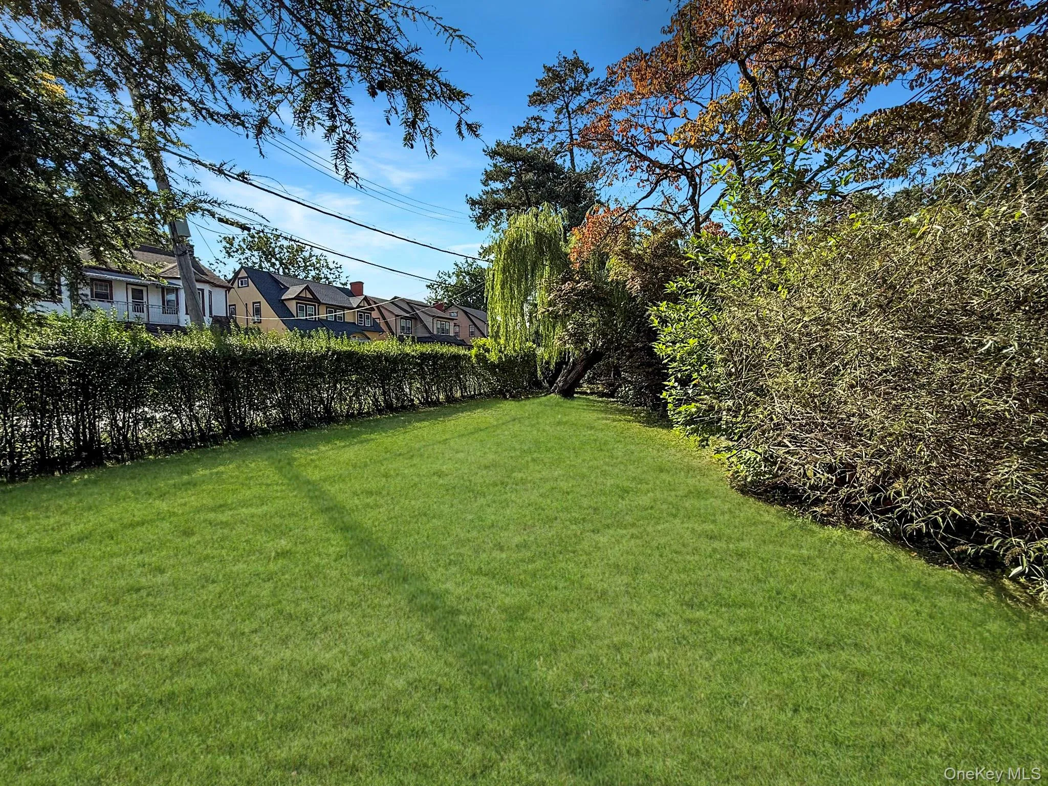 View of green lawn featuring a residential view View of green lawn featuring a residential view