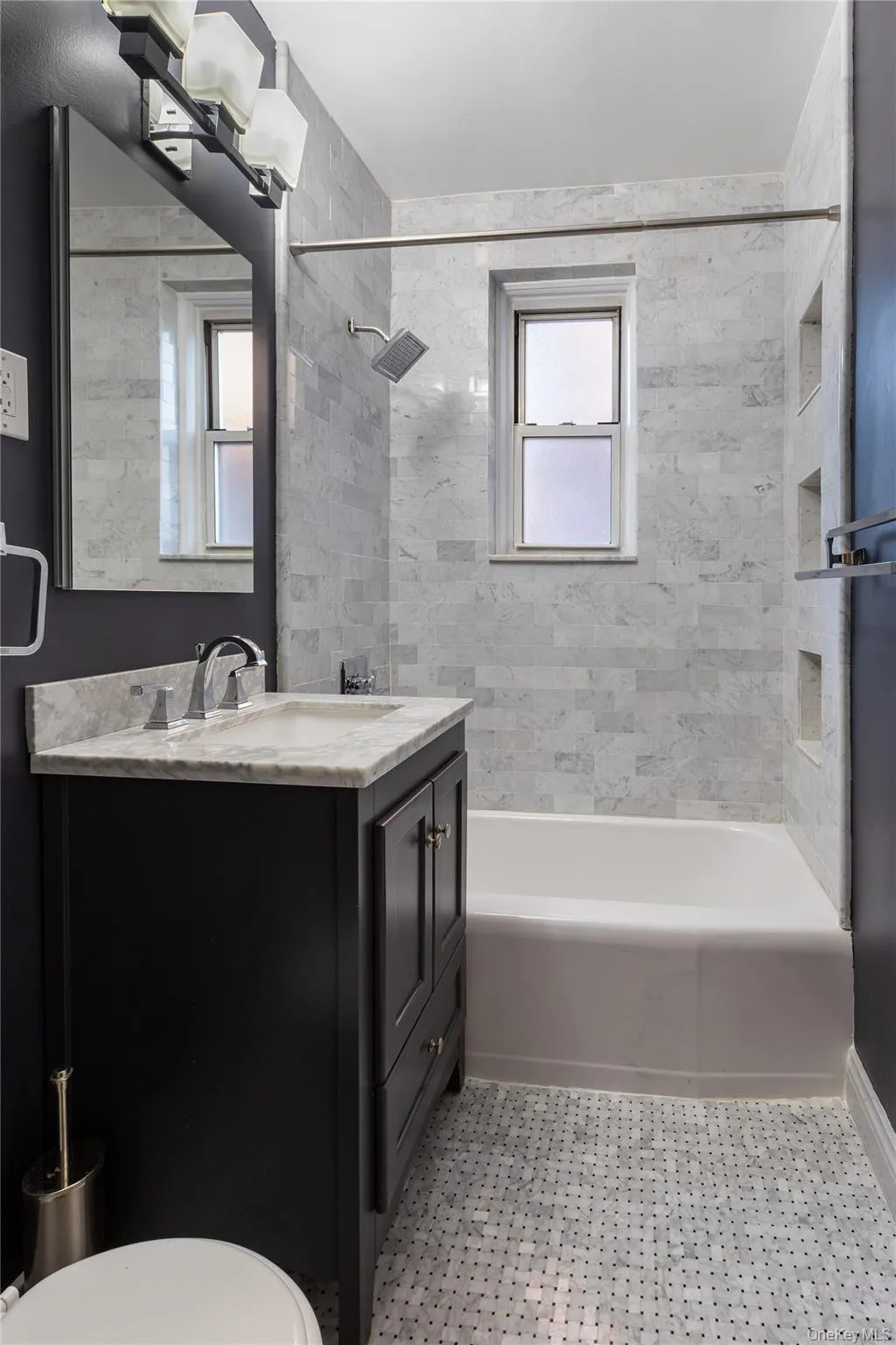 Bathroom featuring washtub / shower combination and vanity Bathroom featuring washtub / shower combination and vanity