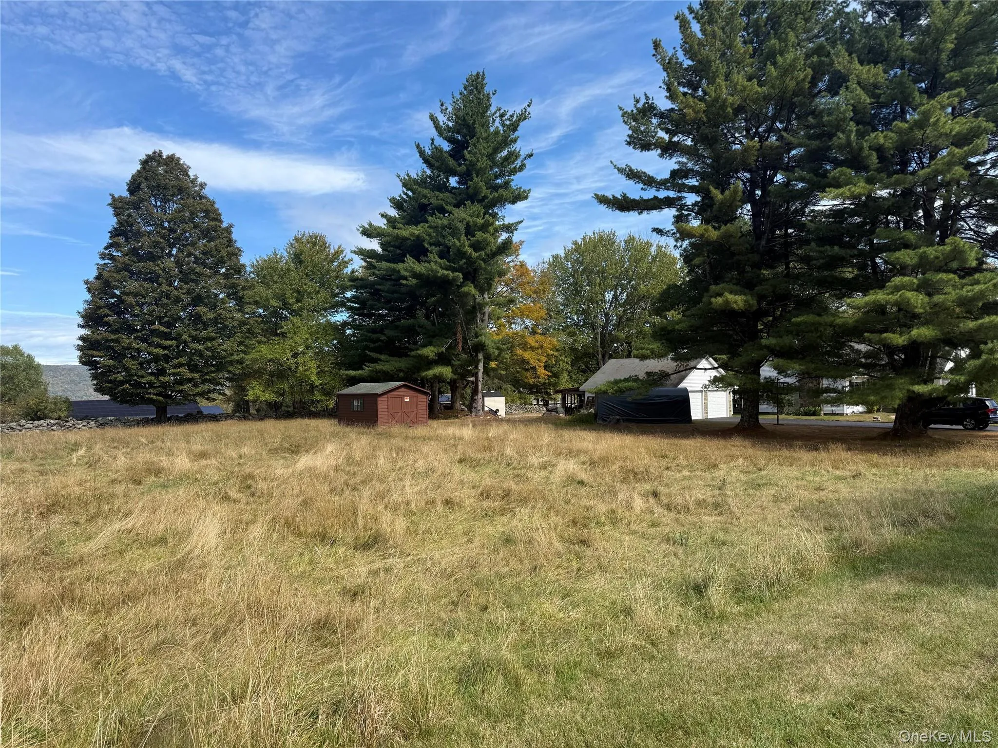 View of lot with a storage shed and a view of countryside View of lot with a storage shed and a view of countryside