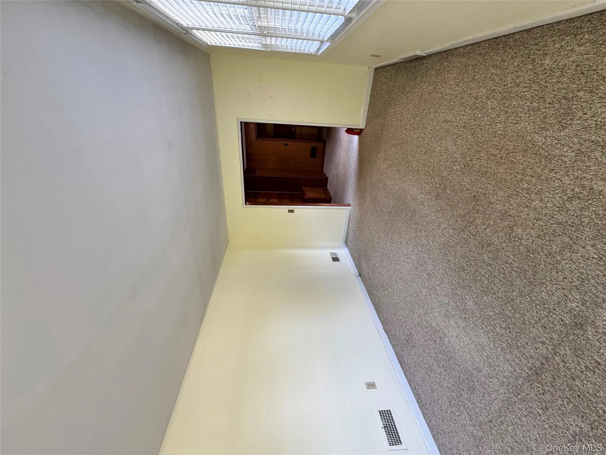 Empty room featuring carpet floors and baseboards Empty room featuring carpet floors and baseboards