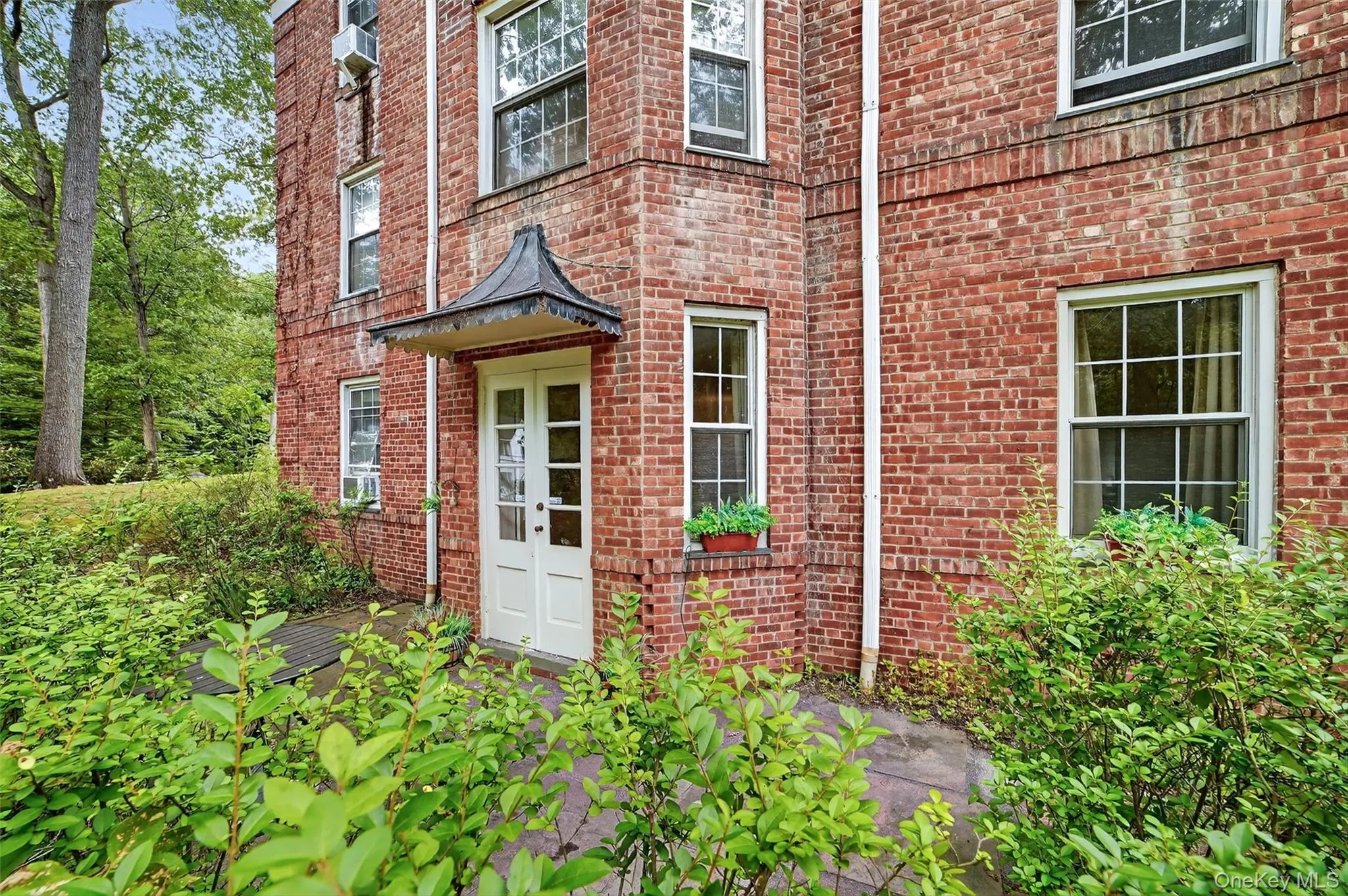Doorway to property with brick siding Doorway to property with brick siding