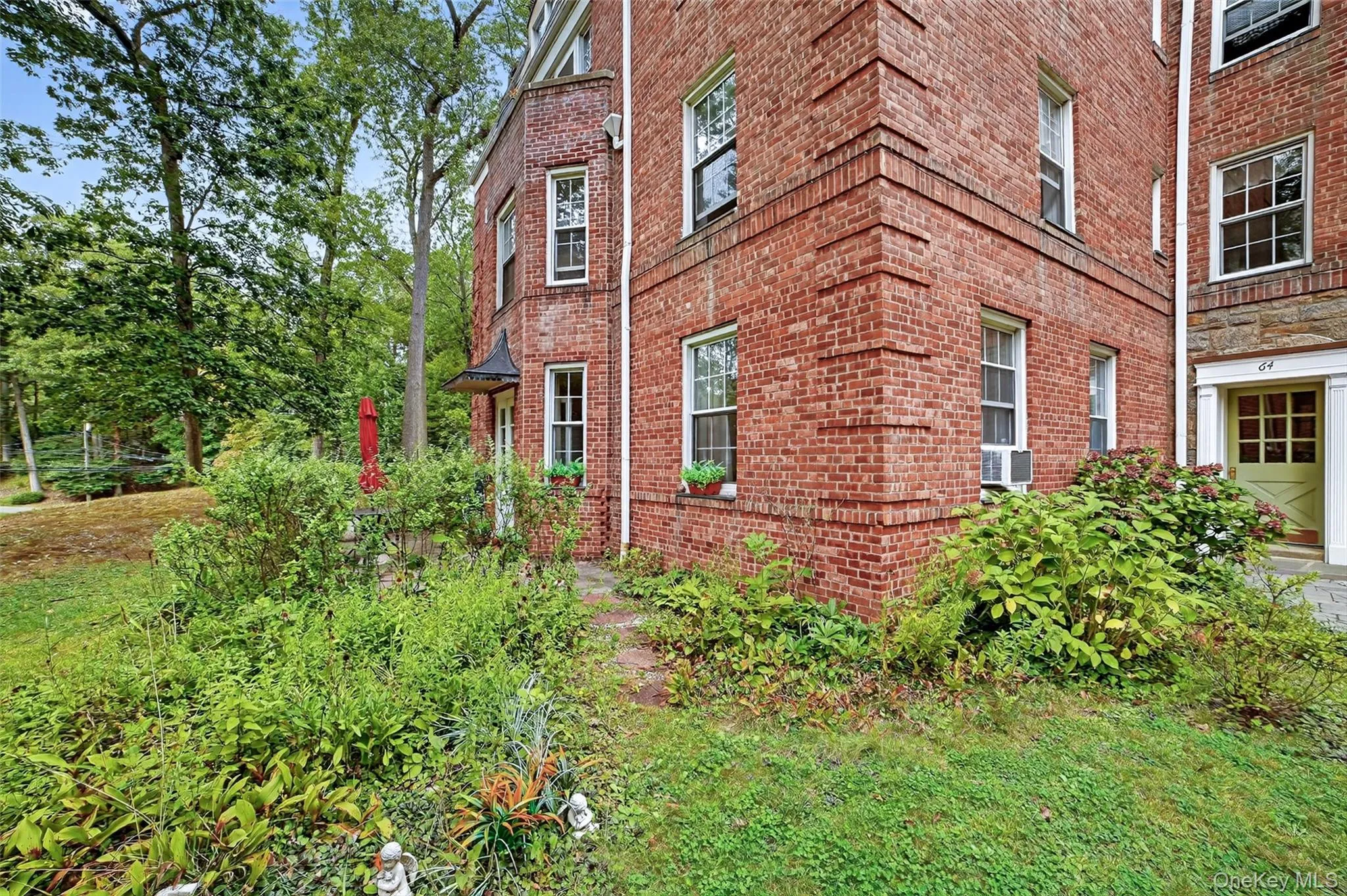 View of side of property featuring brick siding View of side of property featuring brick siding