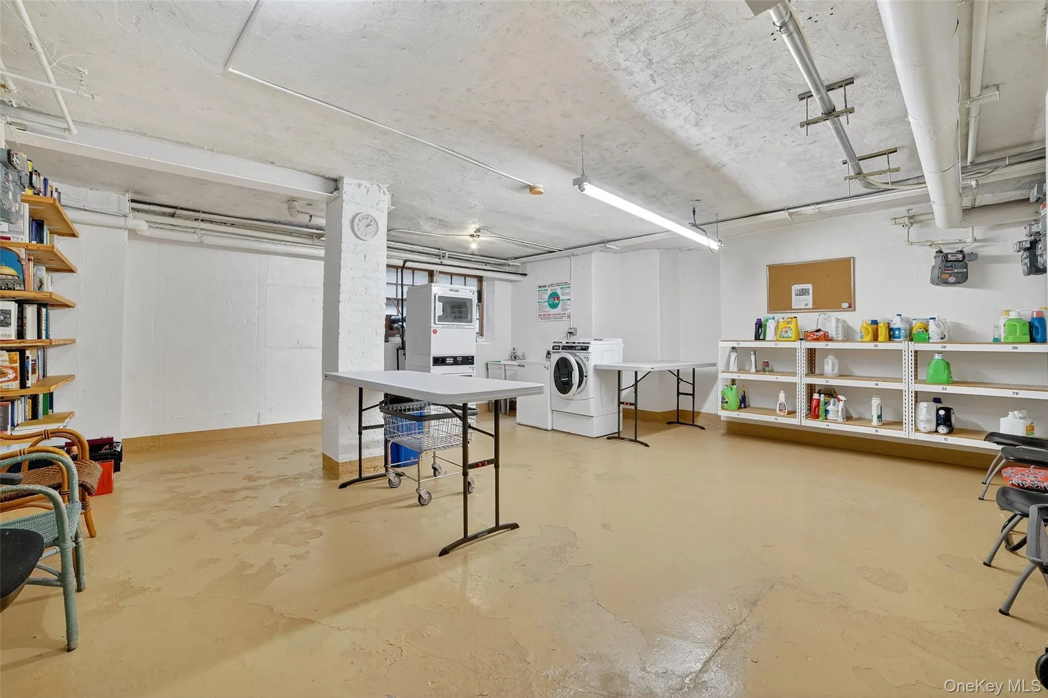 Below grade area with washing machine and dryer Below grade area with washing machine and dryer