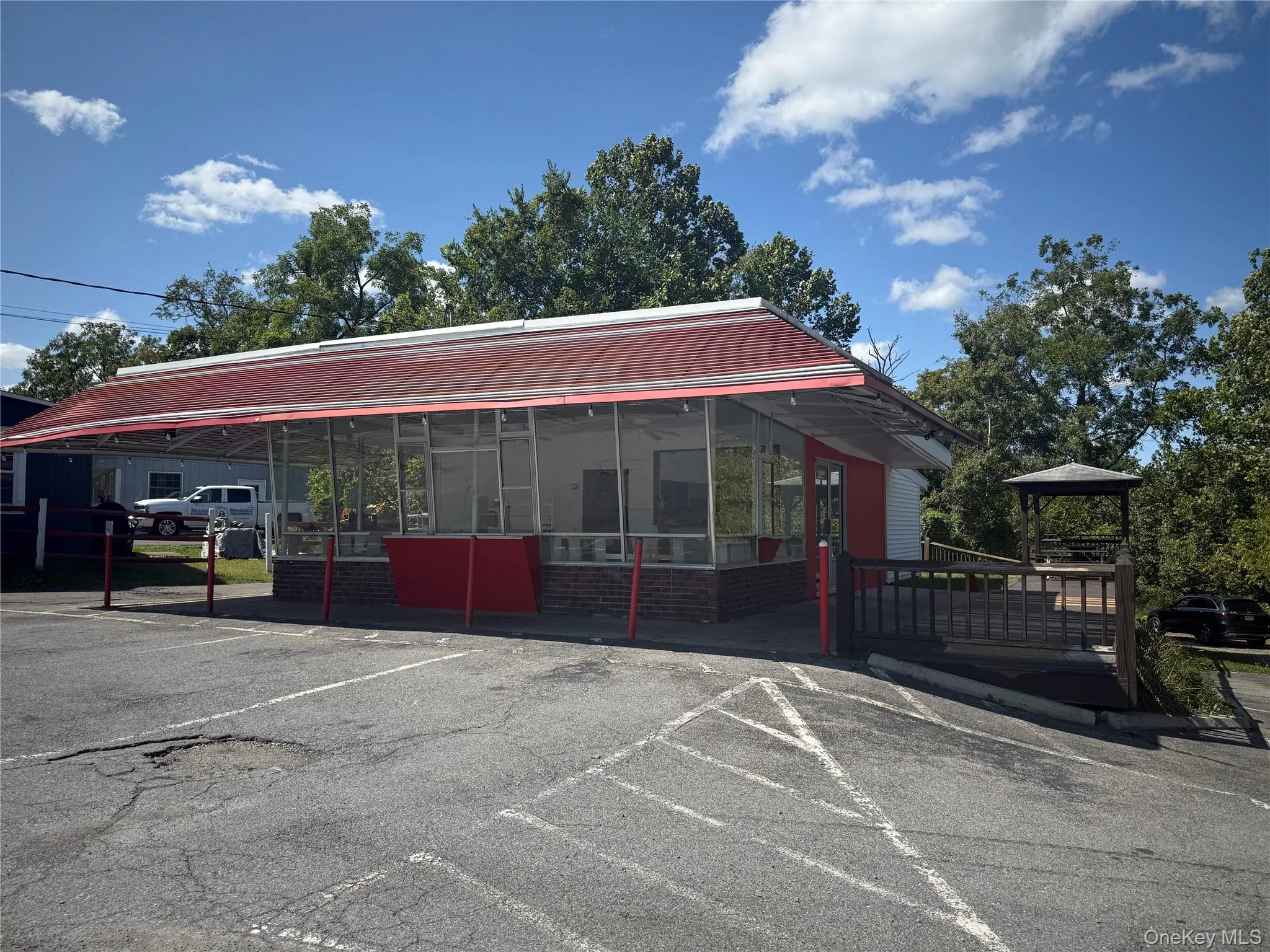 View of property featuring uncovered parking View of property featuring uncovered parking