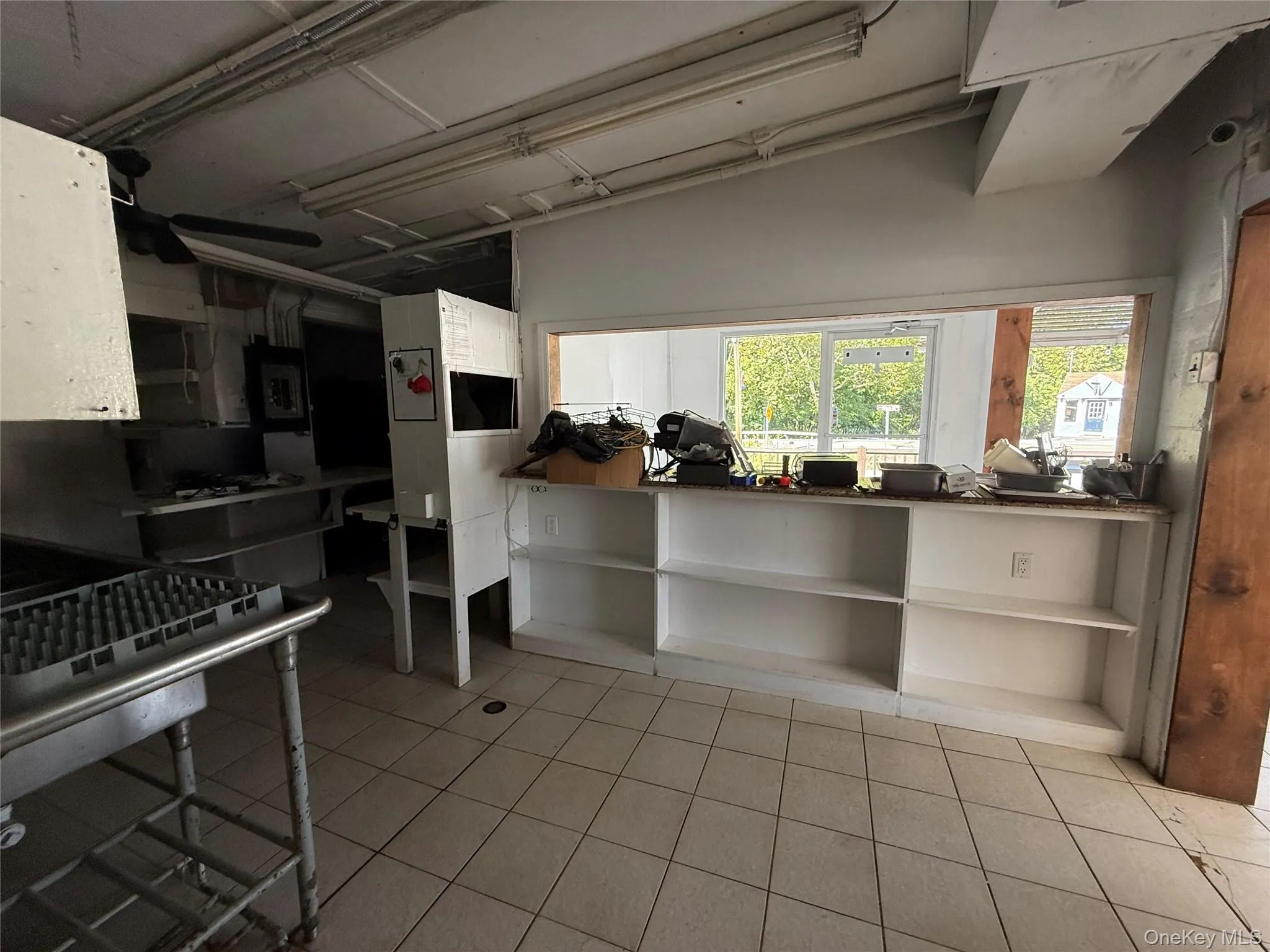 Kitchen with light tile patterned floors Kitchen with light tile patterned floors