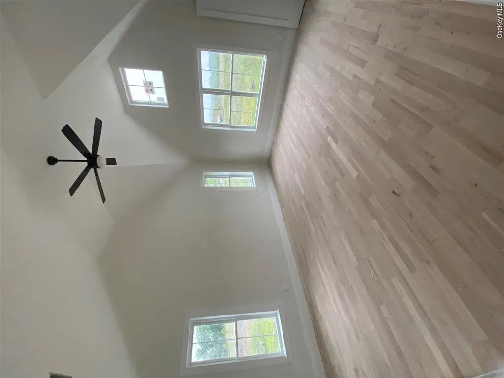 Model Construction Progress Photo. Spacious primary bedroom featuring a ceiling fan, abundant natural light, and an open, comfortable layout. Model Construction Progress Photo. Spacious primary bedroom featuring a ceiling fan, abundant natural light, and an open, comfortable layout.